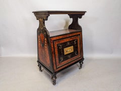An Aesthetic Movement Amboyna and Ebonized Music Cabinet with gilt decoration