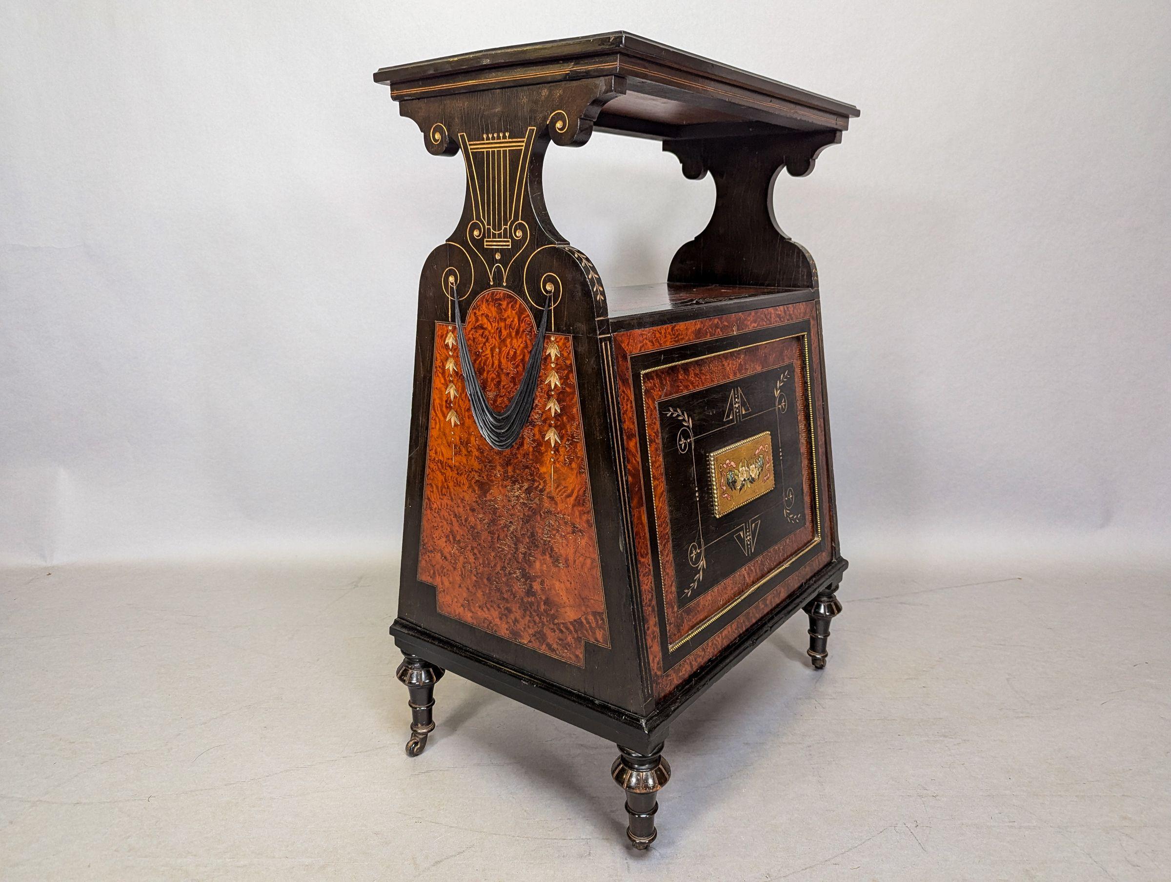 Late 19th Century An Aesthetic Movement Amboyna and Ebonized Music Cabinet with gilt decoration For Sale