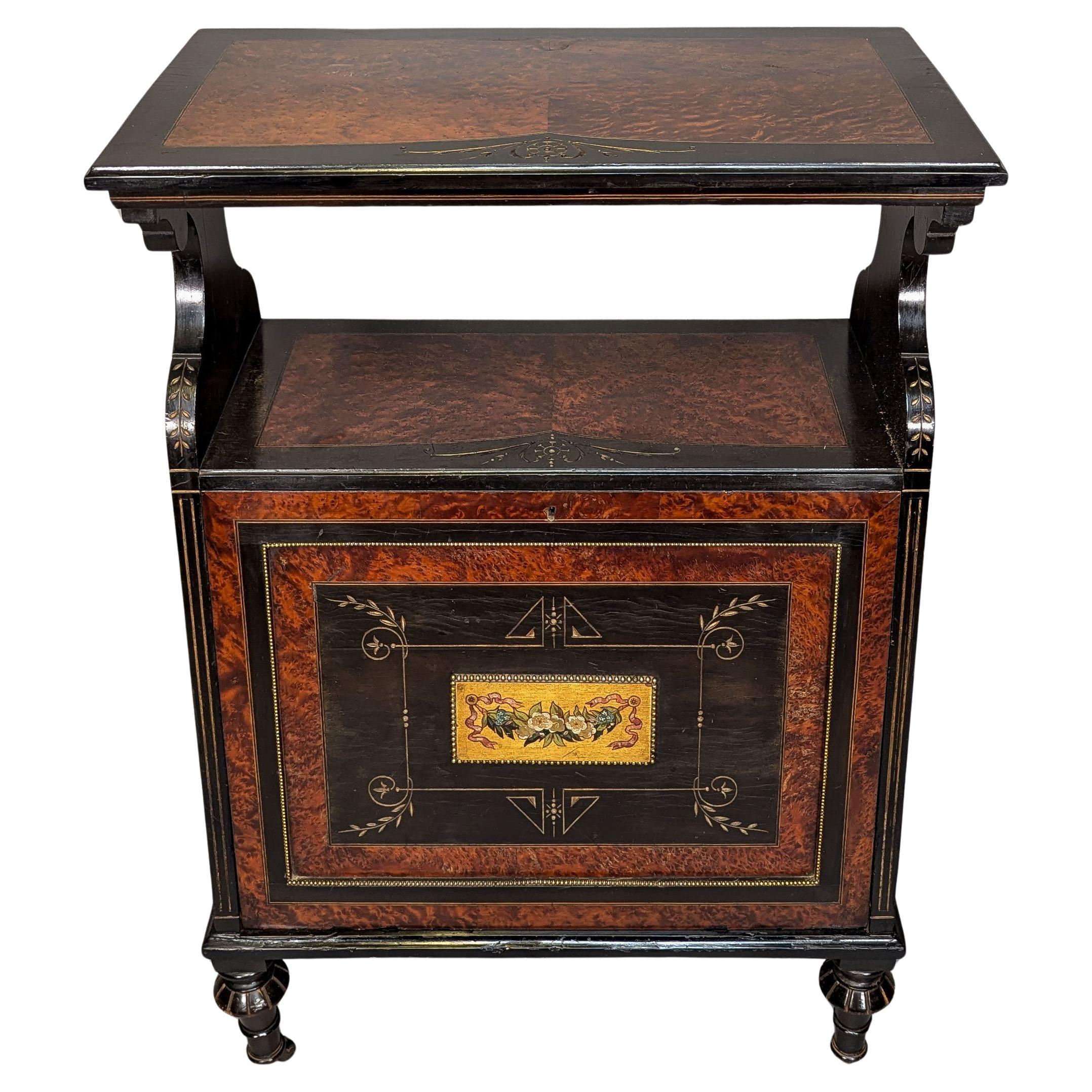 An Aesthetic Movement Amboyna and Ebonized Music Cabinet with gilt decoration