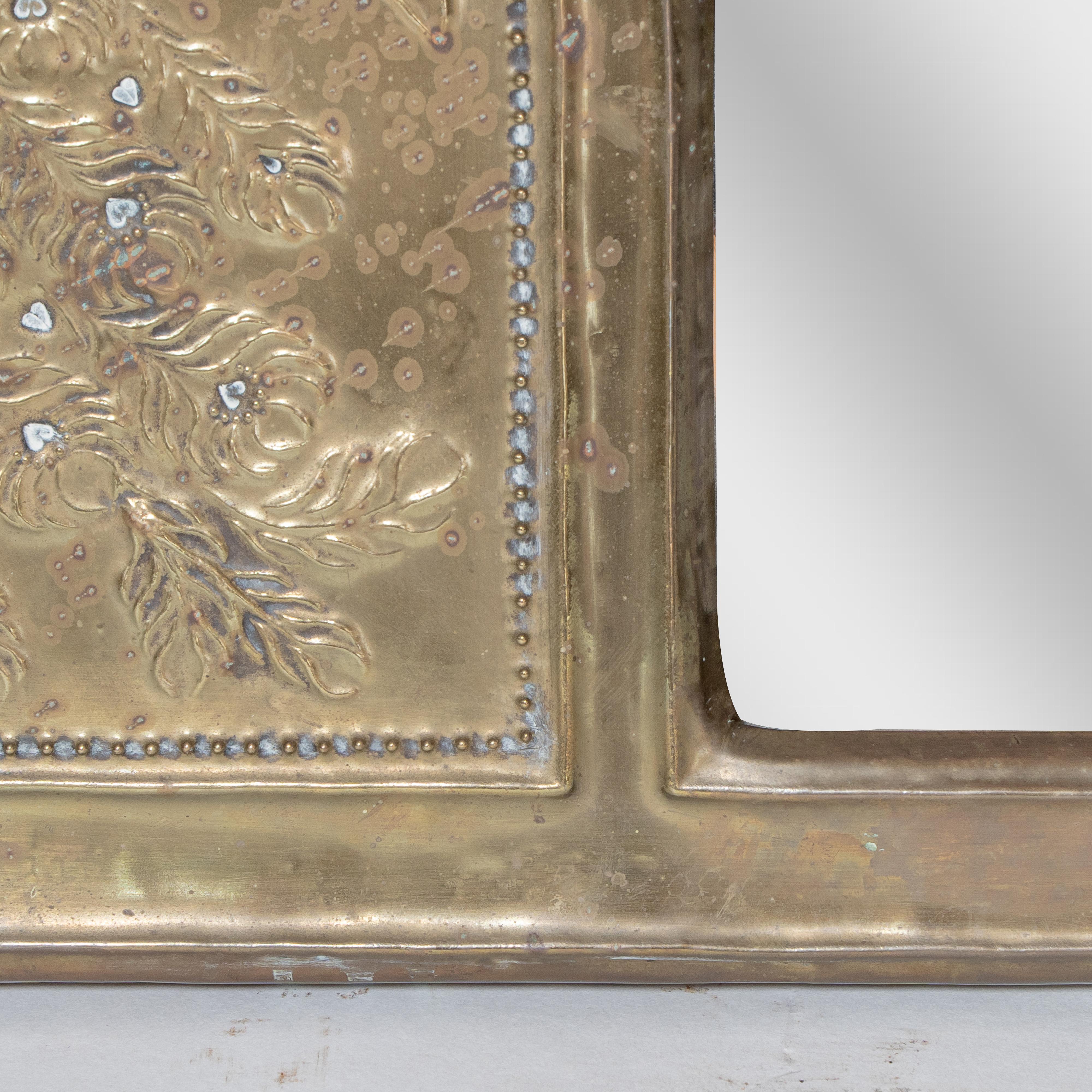 Brass An Aesthetic Movement brass mirror with stylized peacocks perched on a branch For Sale