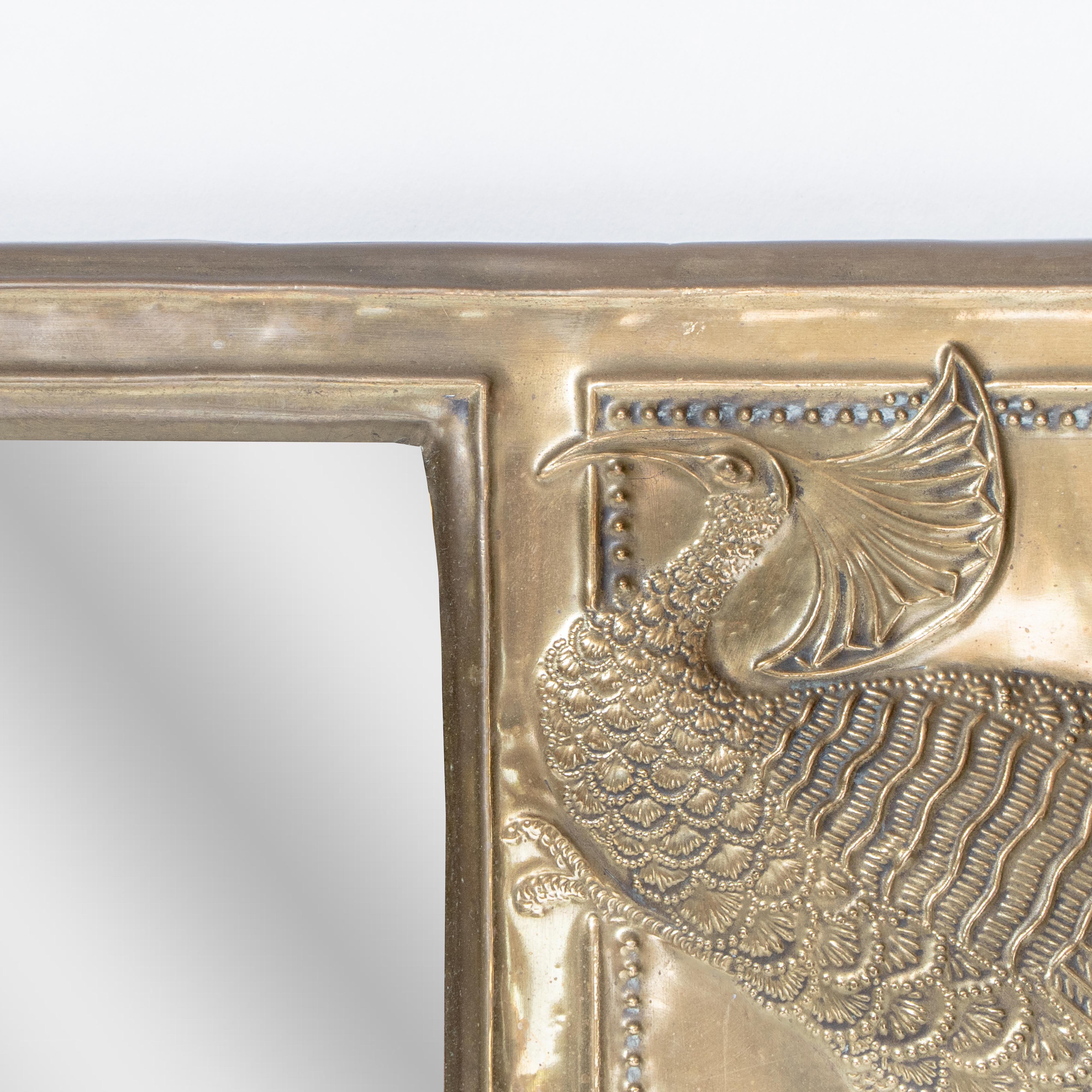 An Aesthetic Movement brass mirror with stylized peacocks perched on a branch For Sale 2