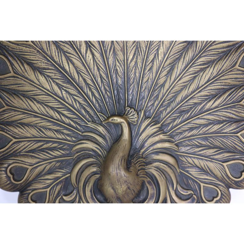Brass An Aesthetic Movement heavy cast brass peacock trivet with fine detailing For Sale