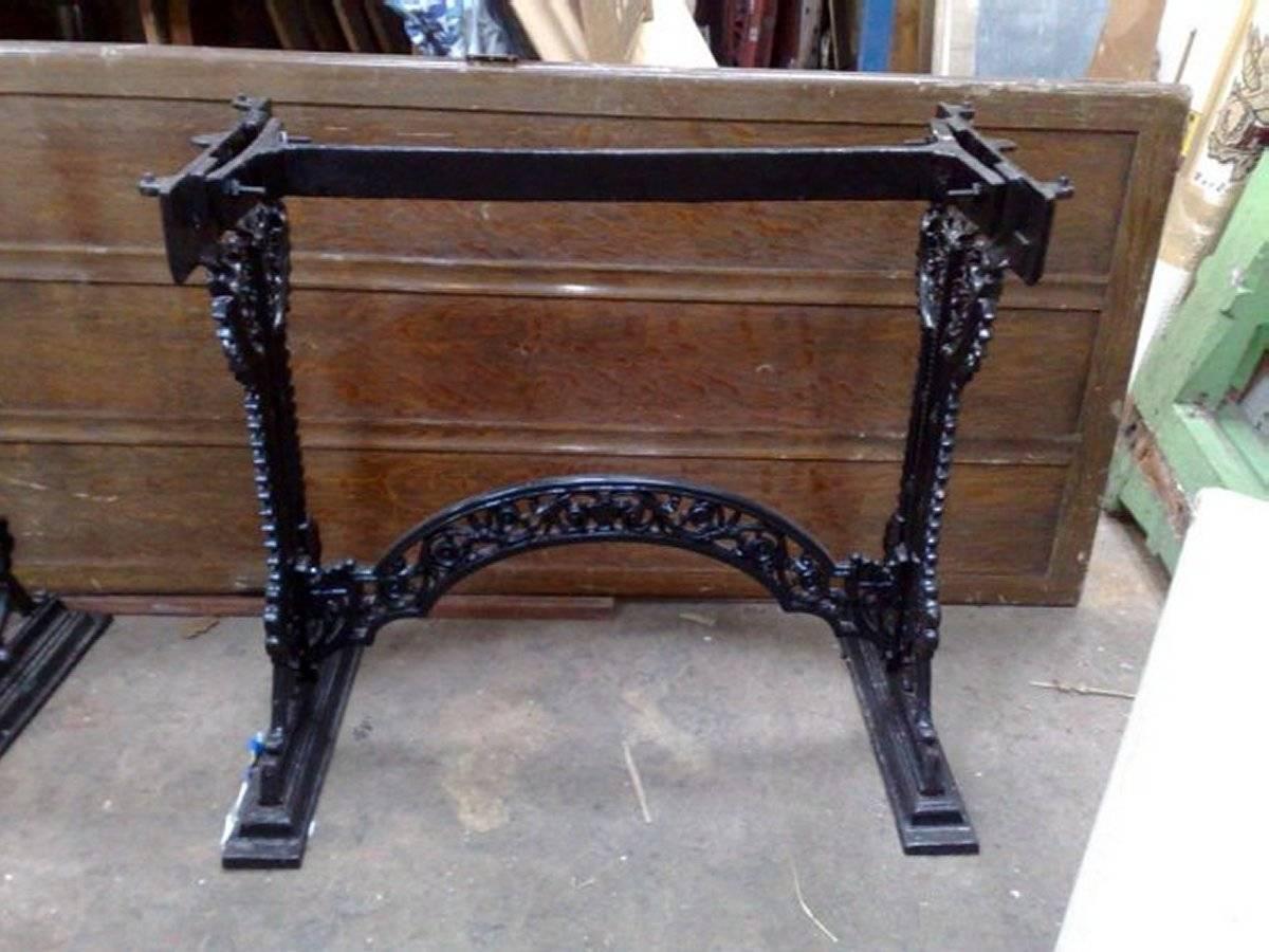 An Aesthetic Movement Victorian cast iron garden table by G Hufton of Birmingham with stylised floral and zig-zag details throughout, an arched stretcher uniting the side uprights stood on plinth style feet. 
The table has been gently bead blasted