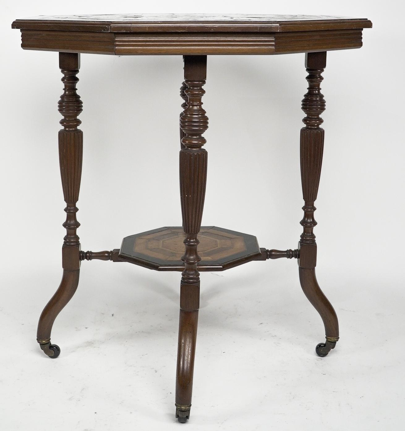 Ebonized An Aesthetic Movement ebonized side table with a marquetry octagonal top For Sale