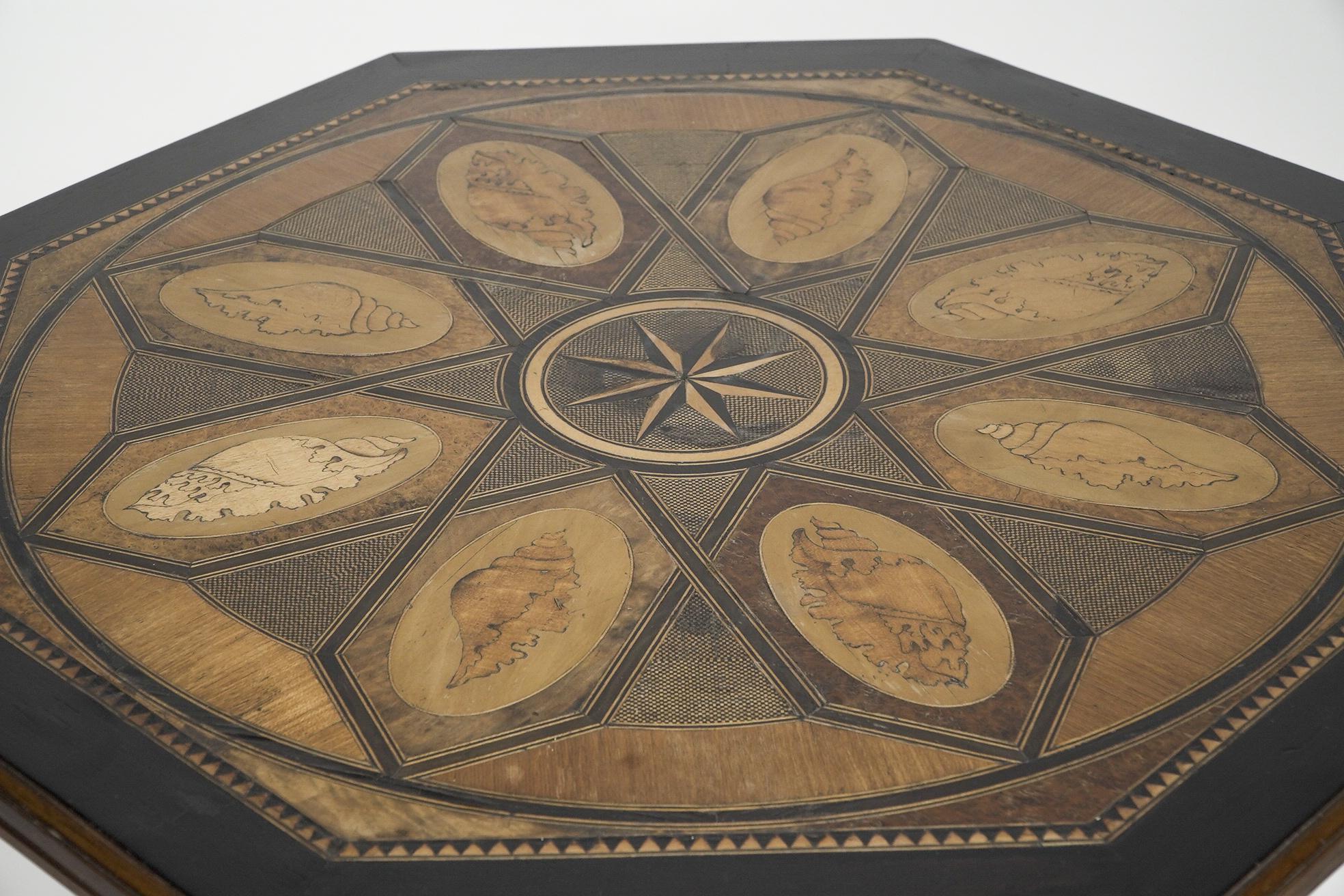 Late 19th Century An Aesthetic Movement ebonized side table with a marquetry octagonal top For Sale