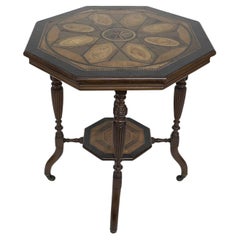 An Aesthetic Movement ebonized side table with a marquetry octagonal top