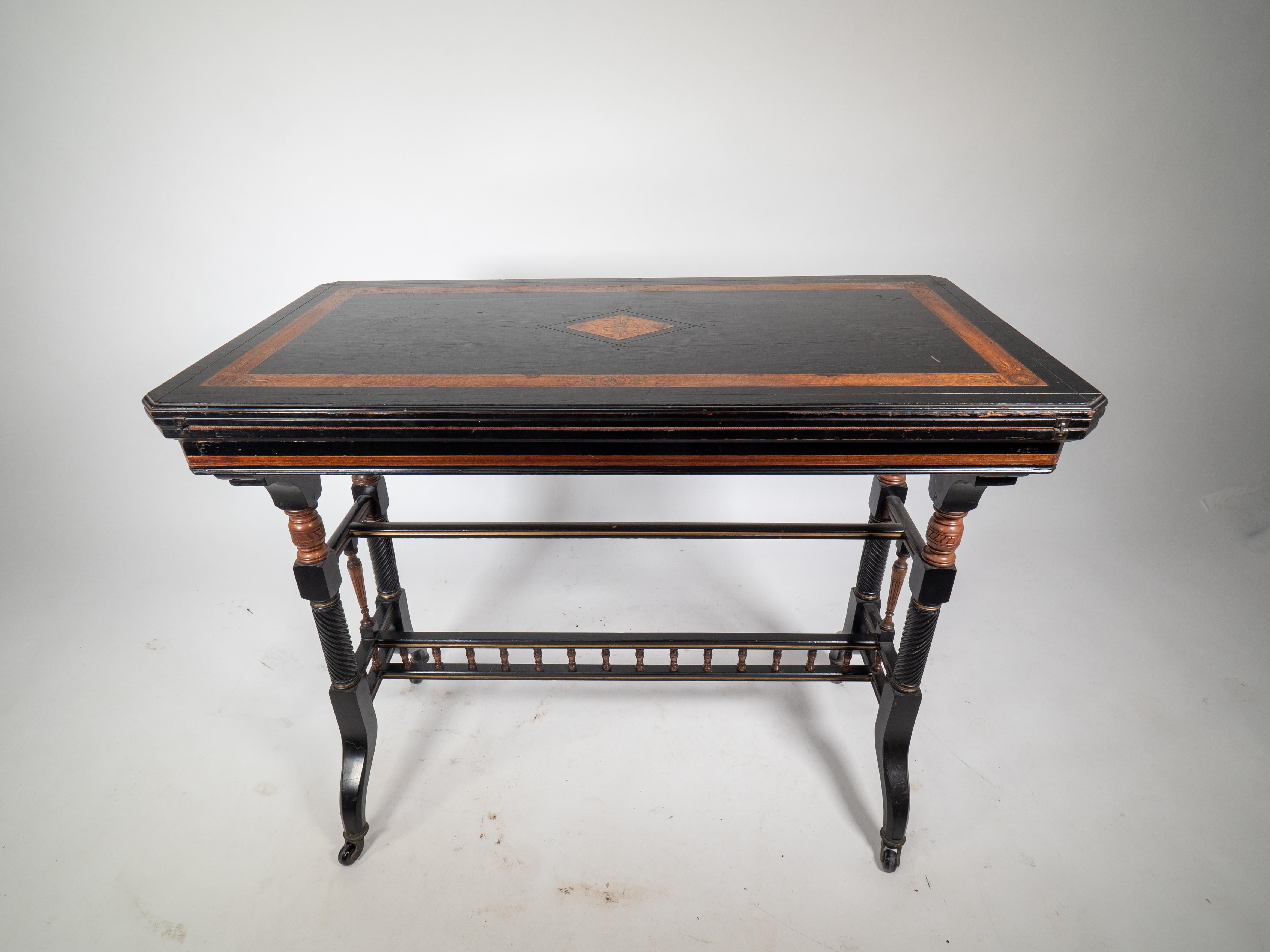 English Gillows attr An Aesthetic Movement ebonized & fold over floral inlaid card table For Sale