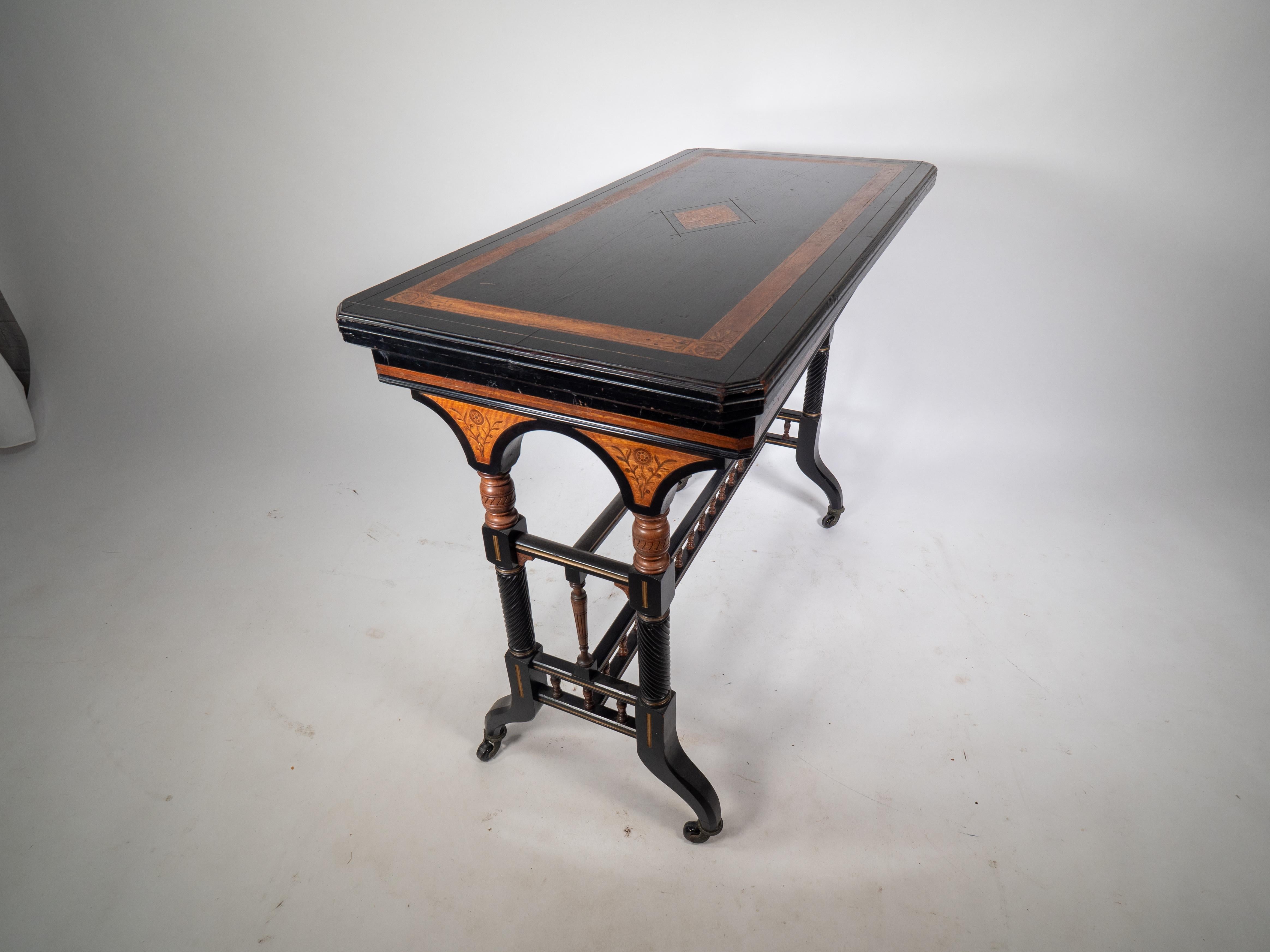 Late 19th Century Gillows attr An Aesthetic Movement ebonized & fold over floral inlaid card table For Sale