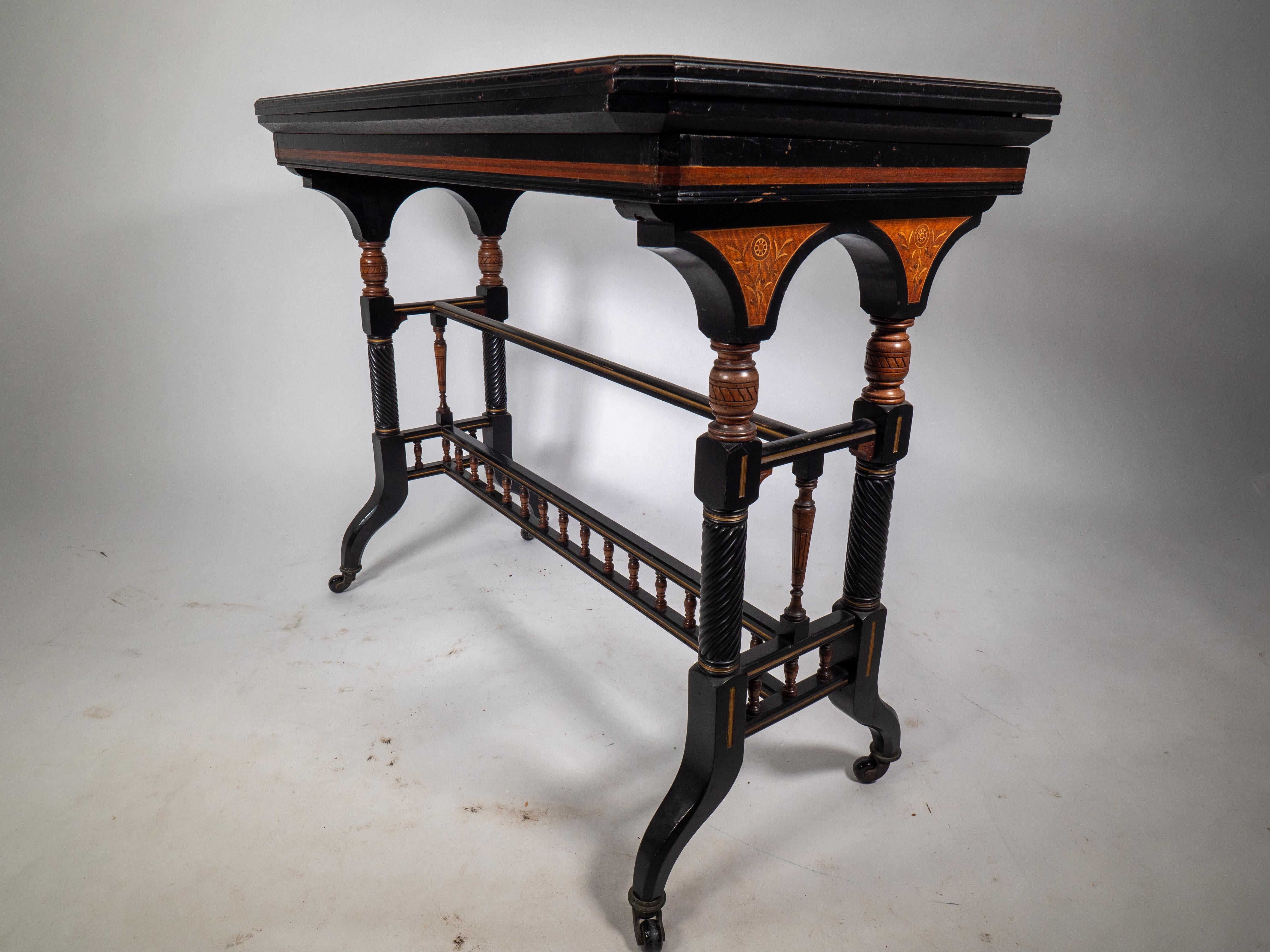 Gillows attr An Aesthetic Movement ebonized & fold over floral inlaid card table For Sale 1