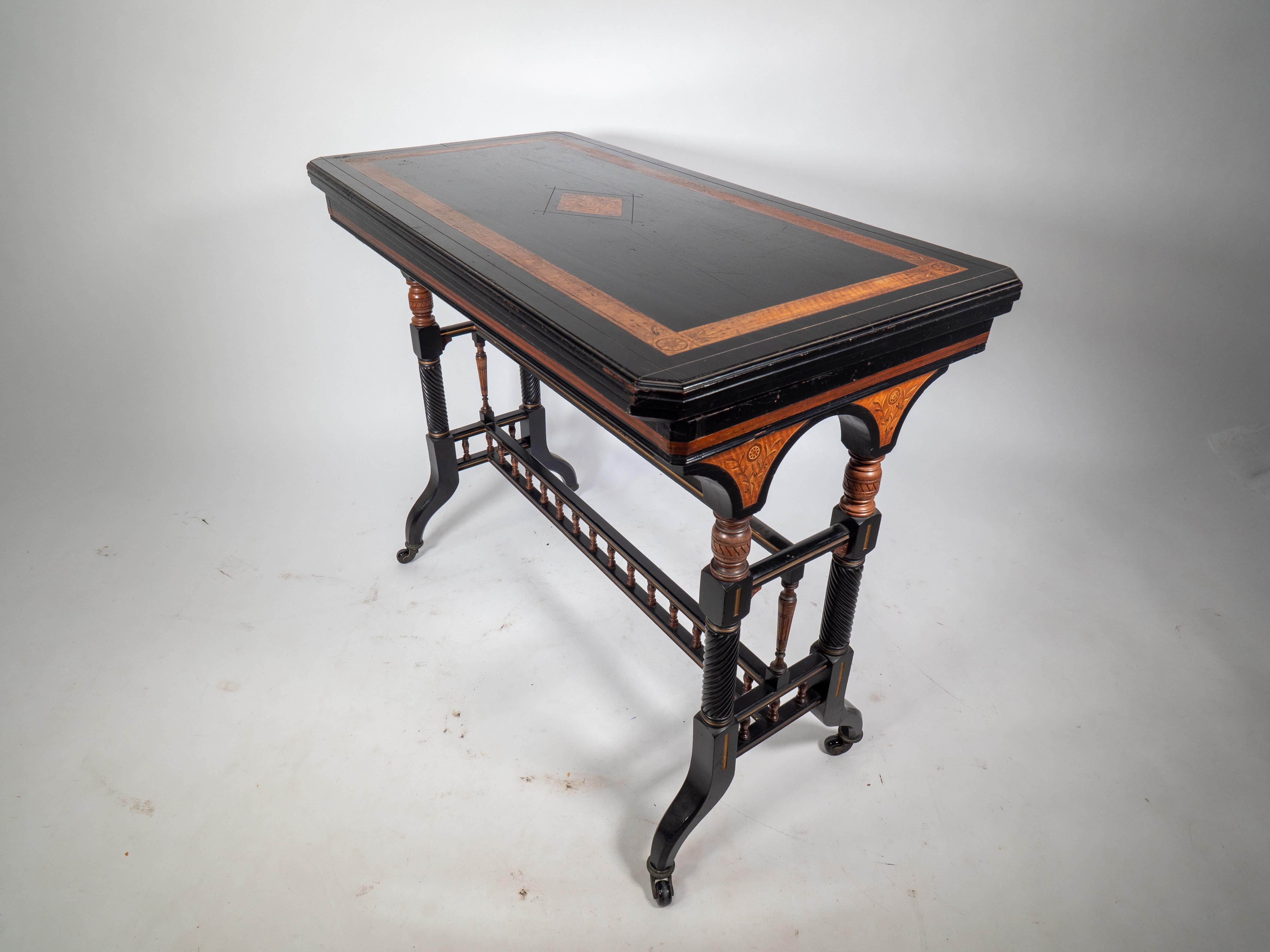 Ebonized Gillows attr An Aesthetic Movement ebonized & fold over floral inlaid card table For Sale