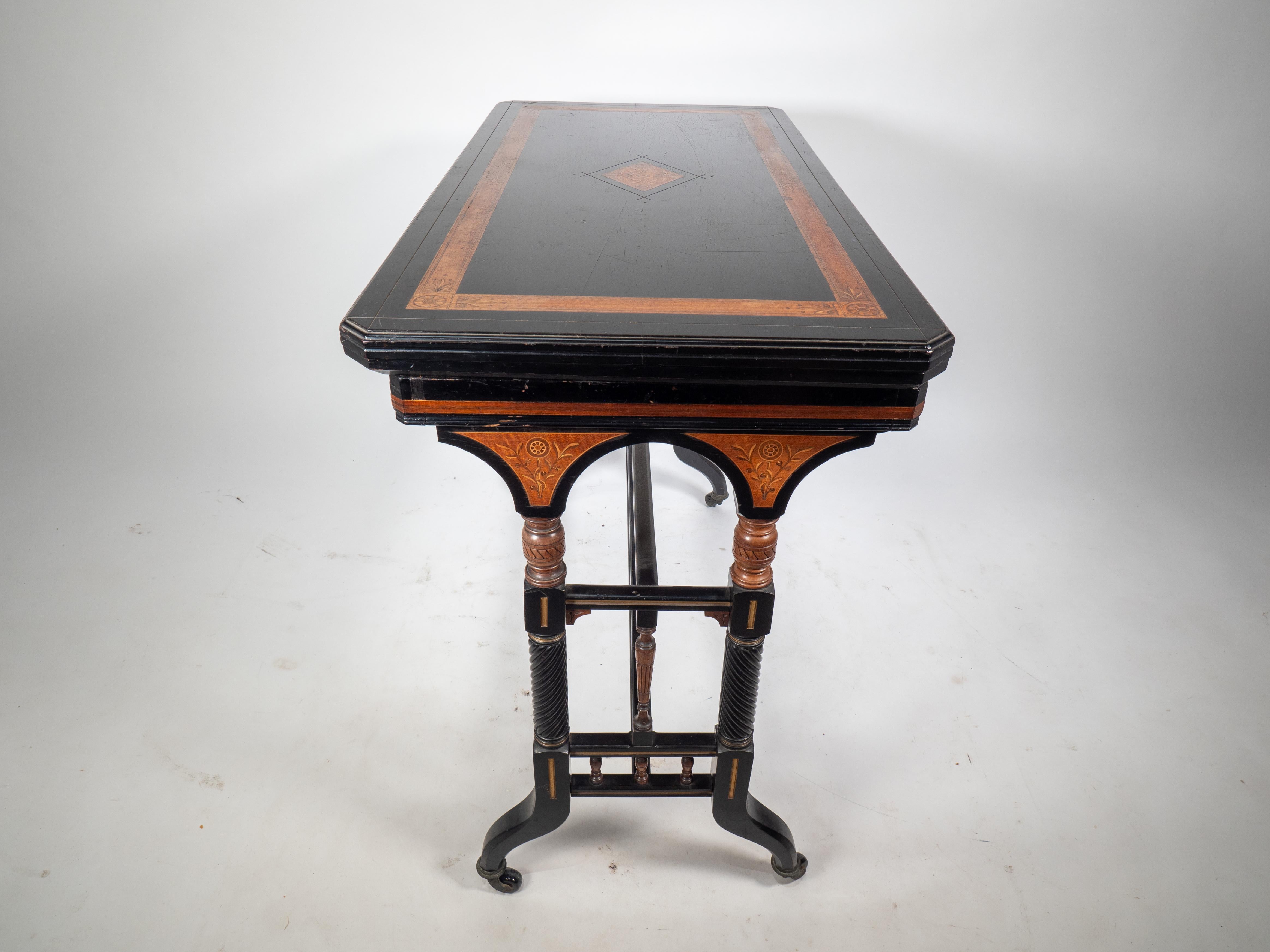 Gillows attr An Aesthetic Movement ebonized & fold over floral inlaid card table In Good Condition For Sale In London, GB