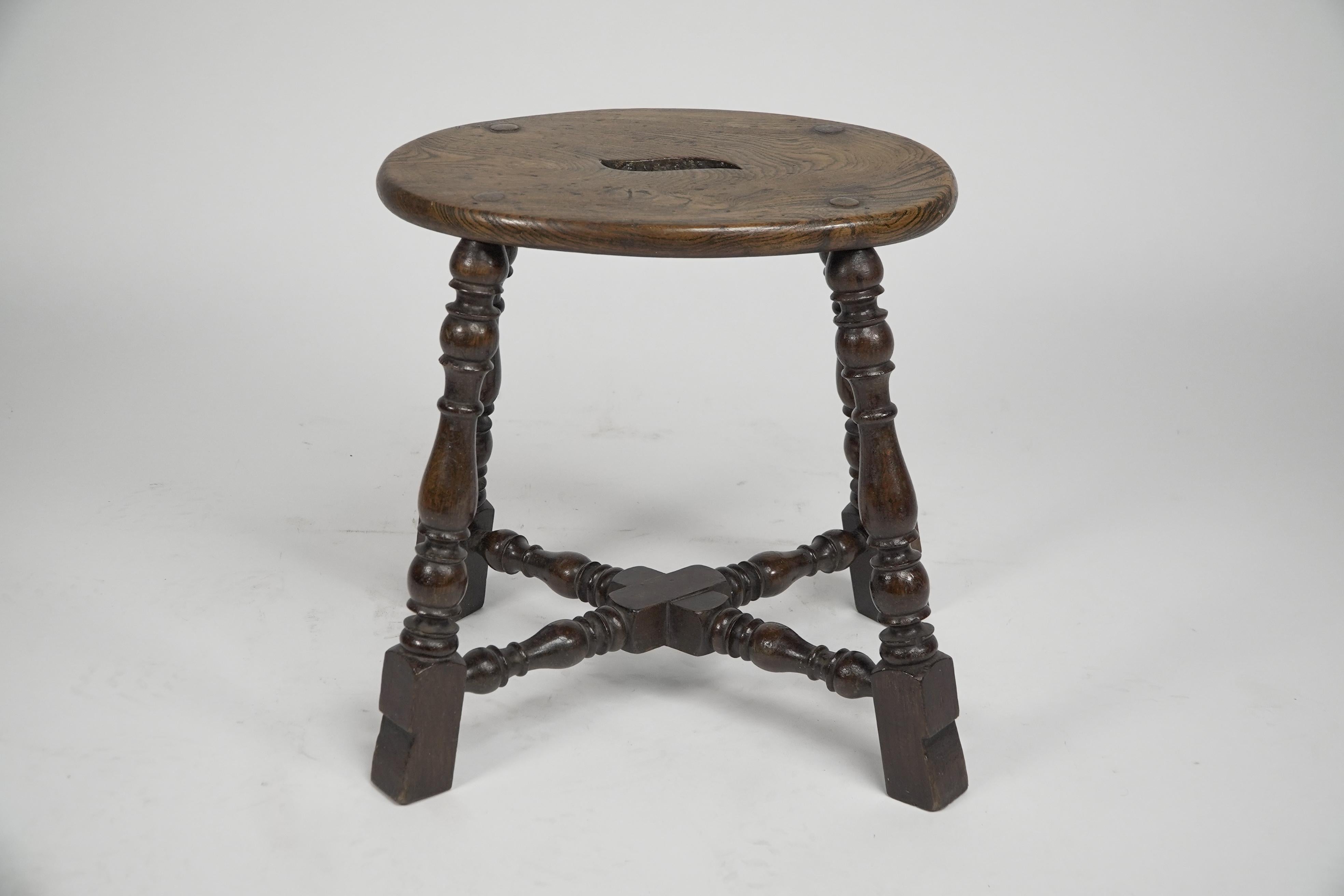 An Aesthetic Movement Elm stool with a 'S' handle, and a wild grain to the seat. For Sale 2