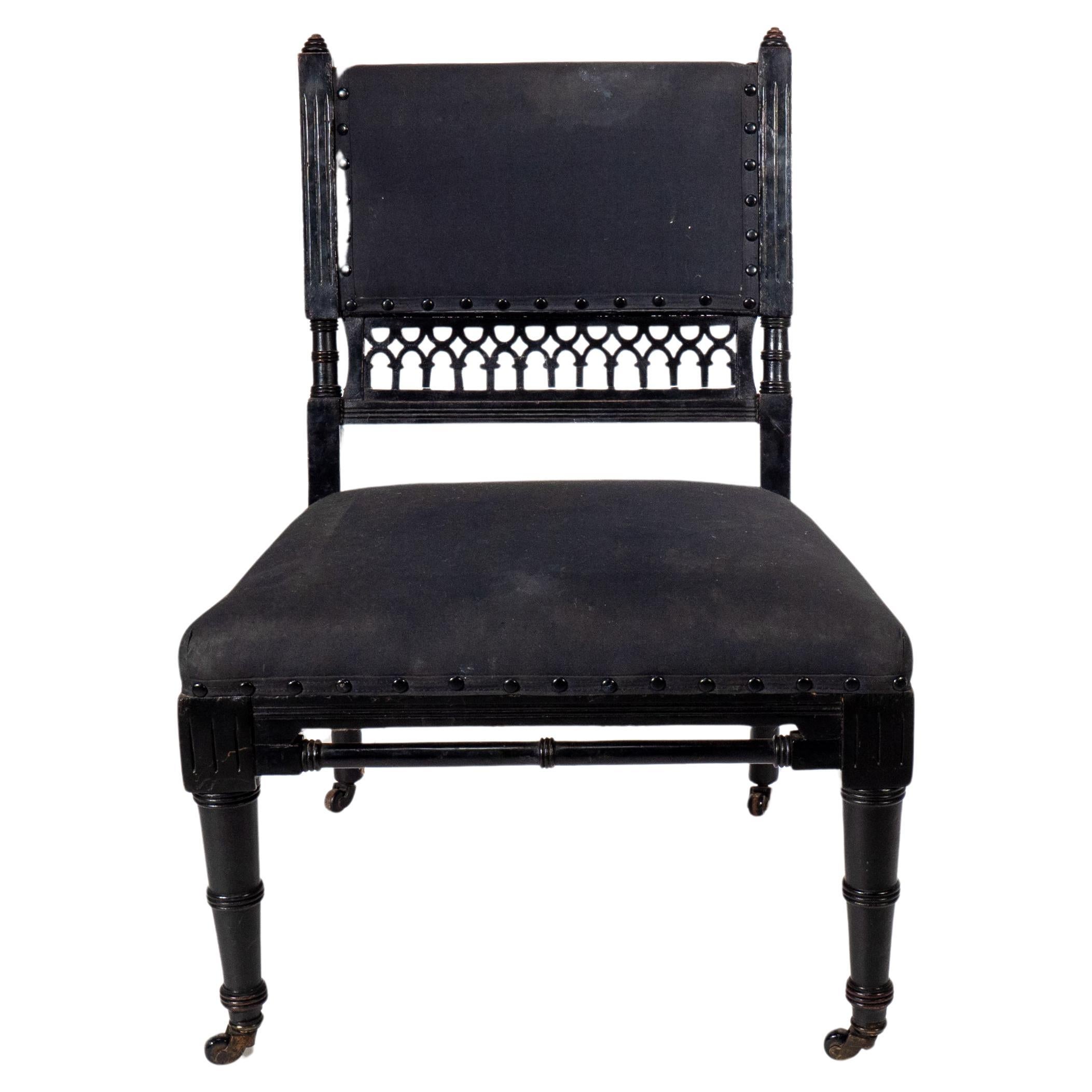 An Aesthetic Movement low side chair with fretwork to the lower back rest