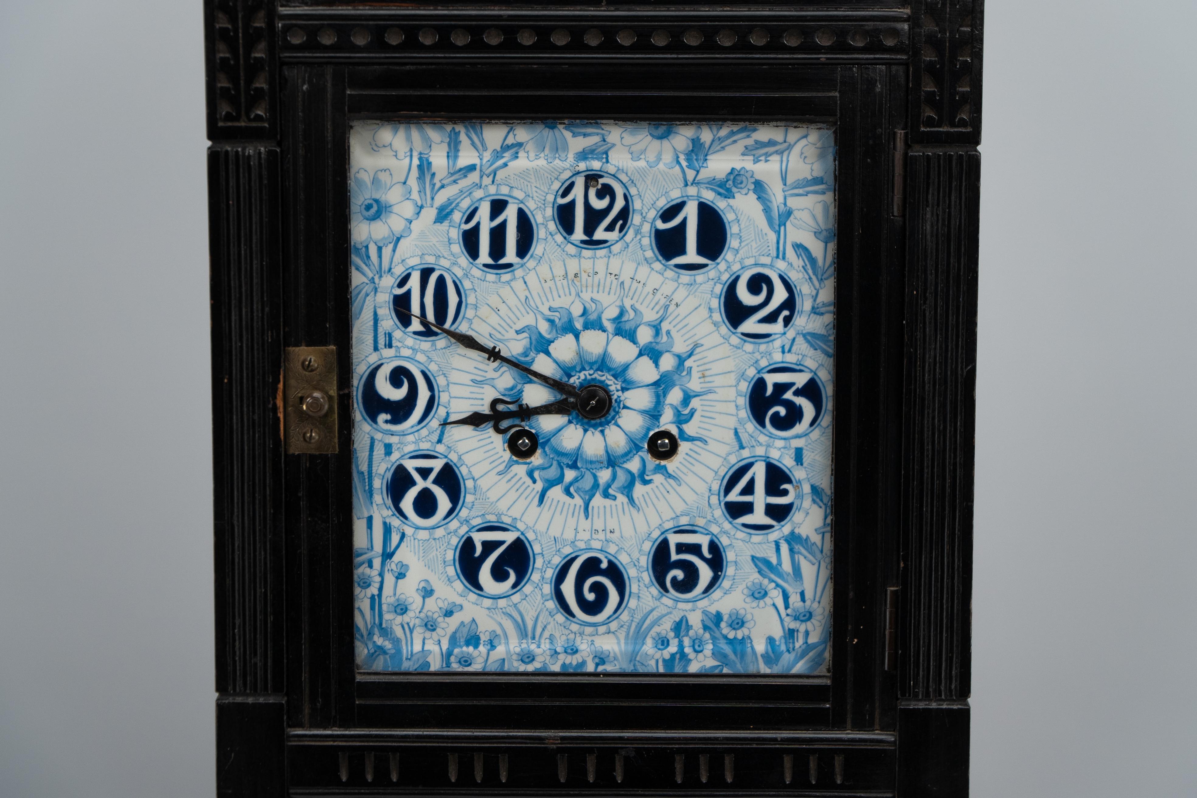 Walnut Lewis Foreman Day. A rare Aesthetic Movement mantel clock with floral decoration For Sale