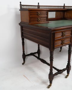 An Aesthetic Movement oak knee hole desk