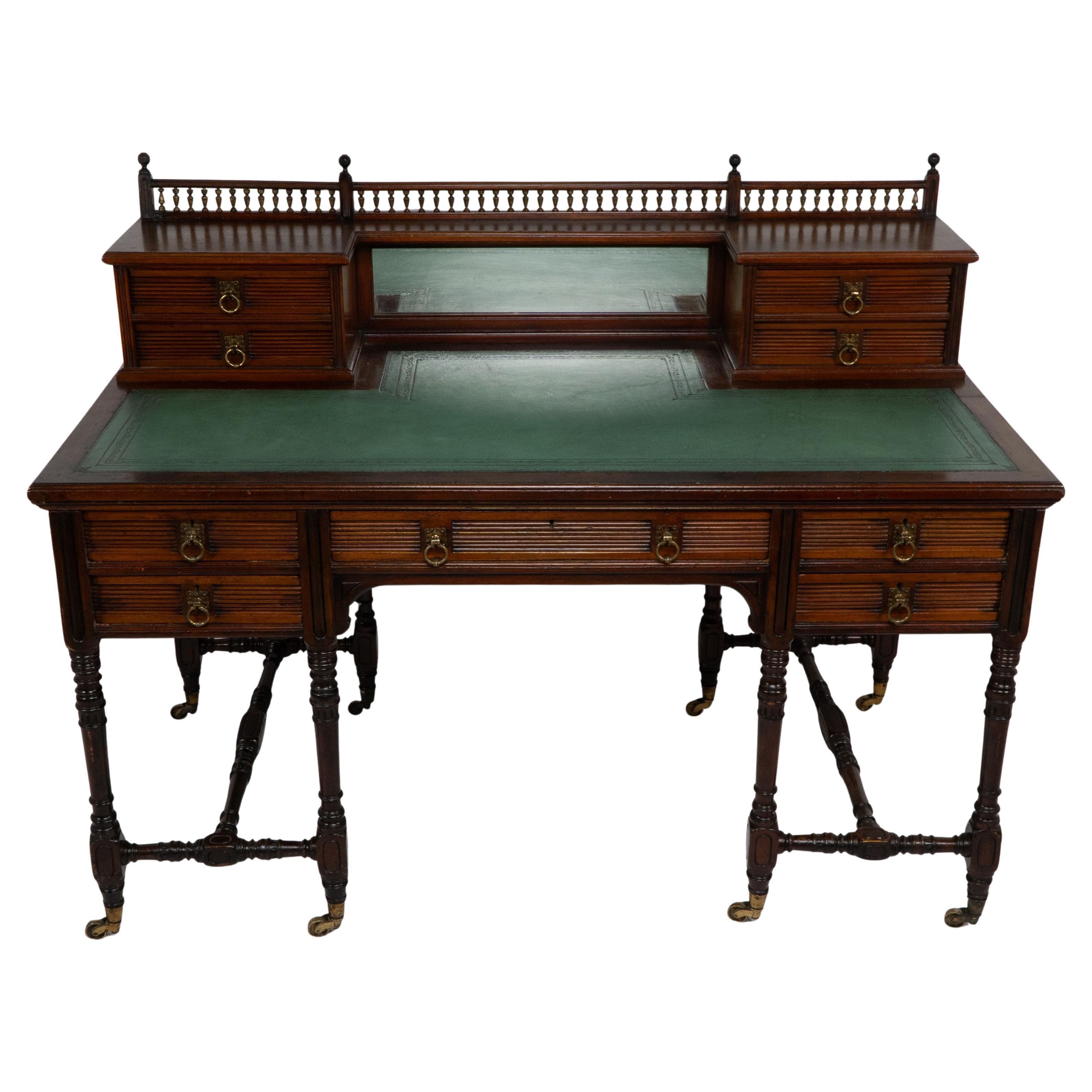 An Aesthetic Movement oak knee hole desk