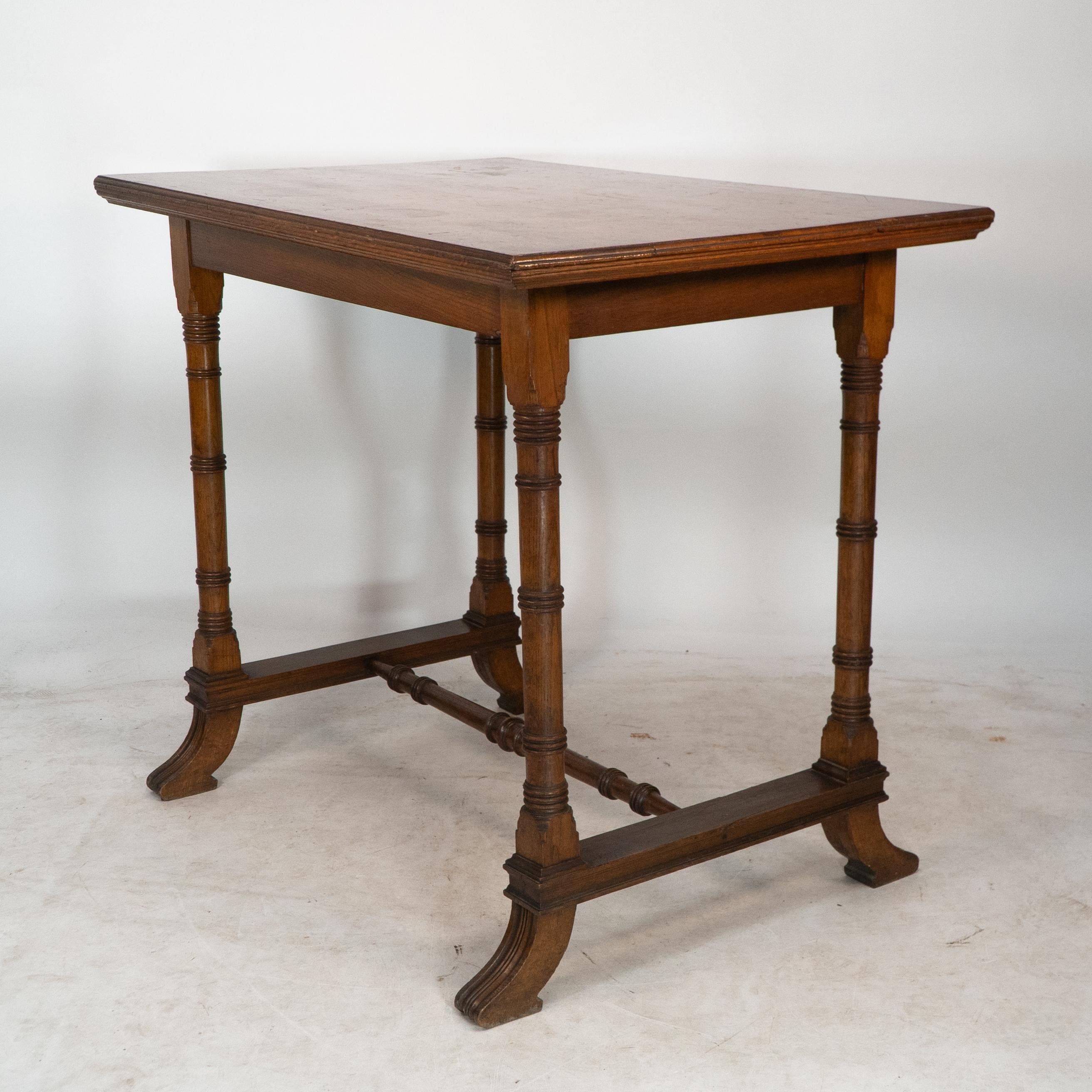 Late 19th Century Aesthetic Movement oak oblong side table with ring turned legs, and splayed feet For Sale