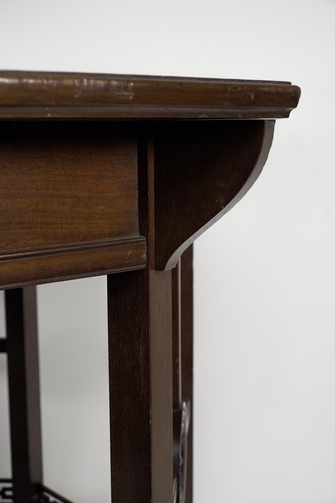 Mahogany Gillows attr, An Aesthetic Movement octagonal walnut eight leg centre table For Sale
