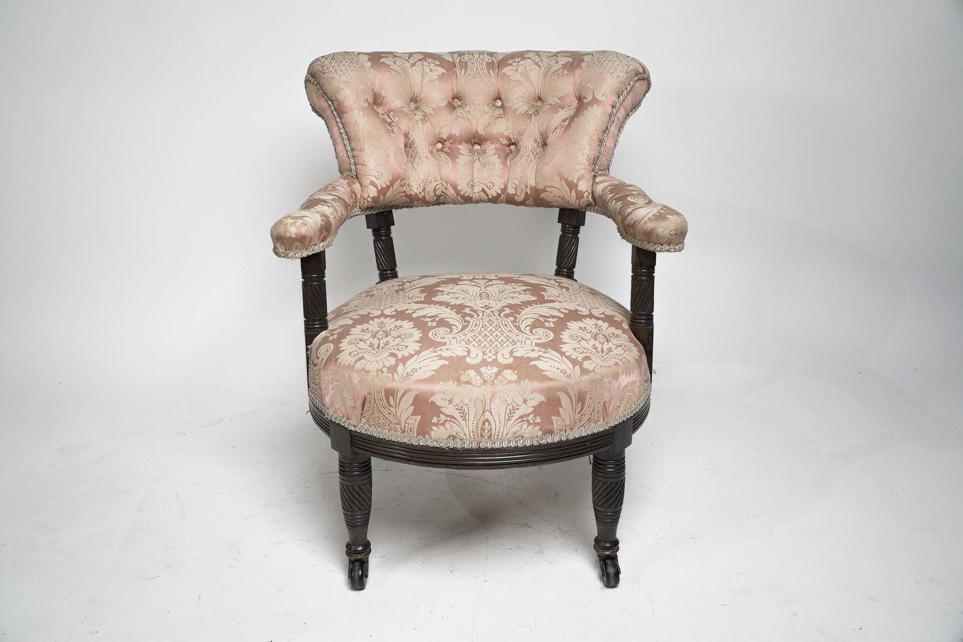 Bruce Talbert for Gillows. An Aesthetic Movement Rosewood armchair with a pink button back upholstered back and seat.