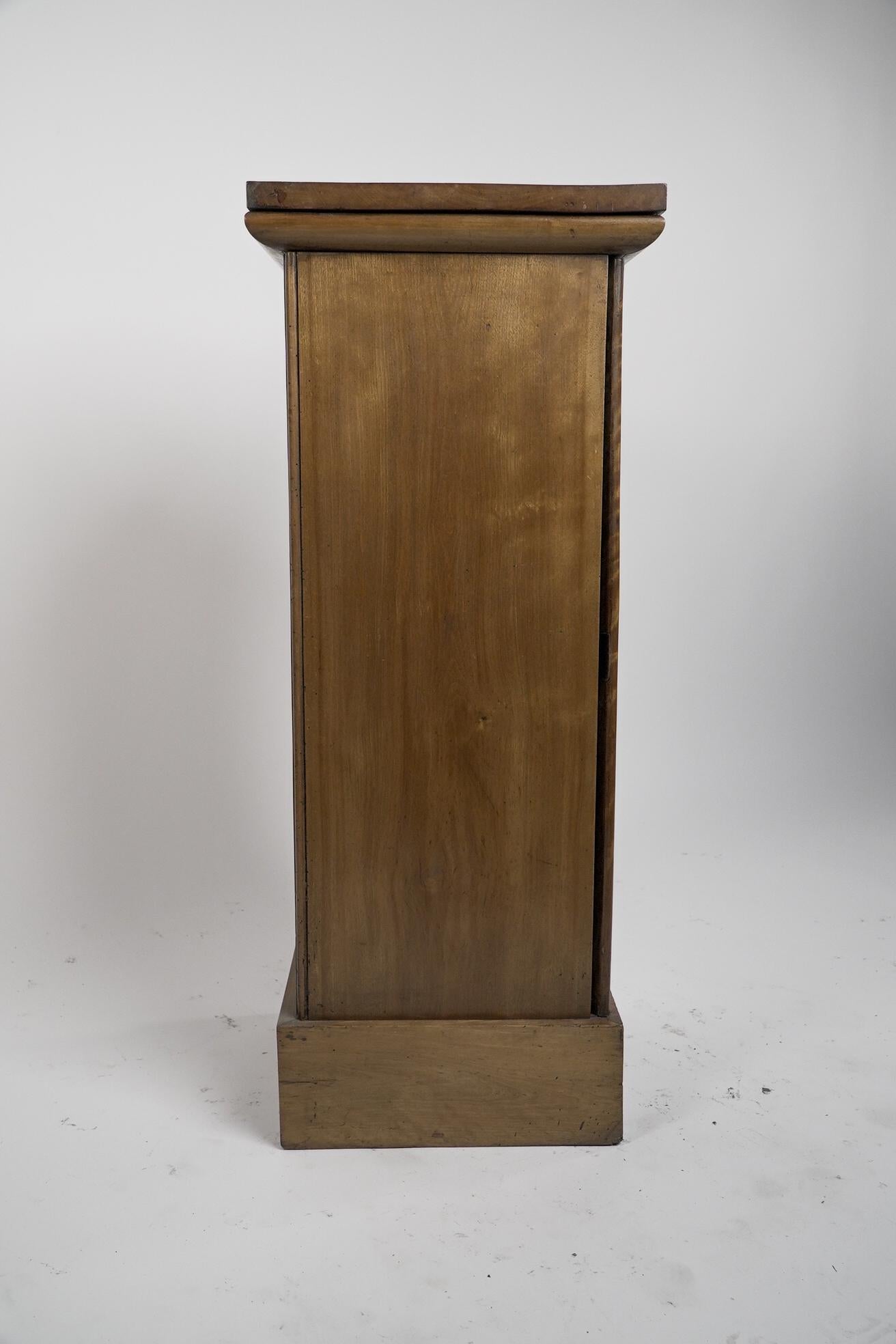 Late 19th Century An Aesthetic Movement Satin Birch bedside cabinet with a central Walnut handle. For Sale
