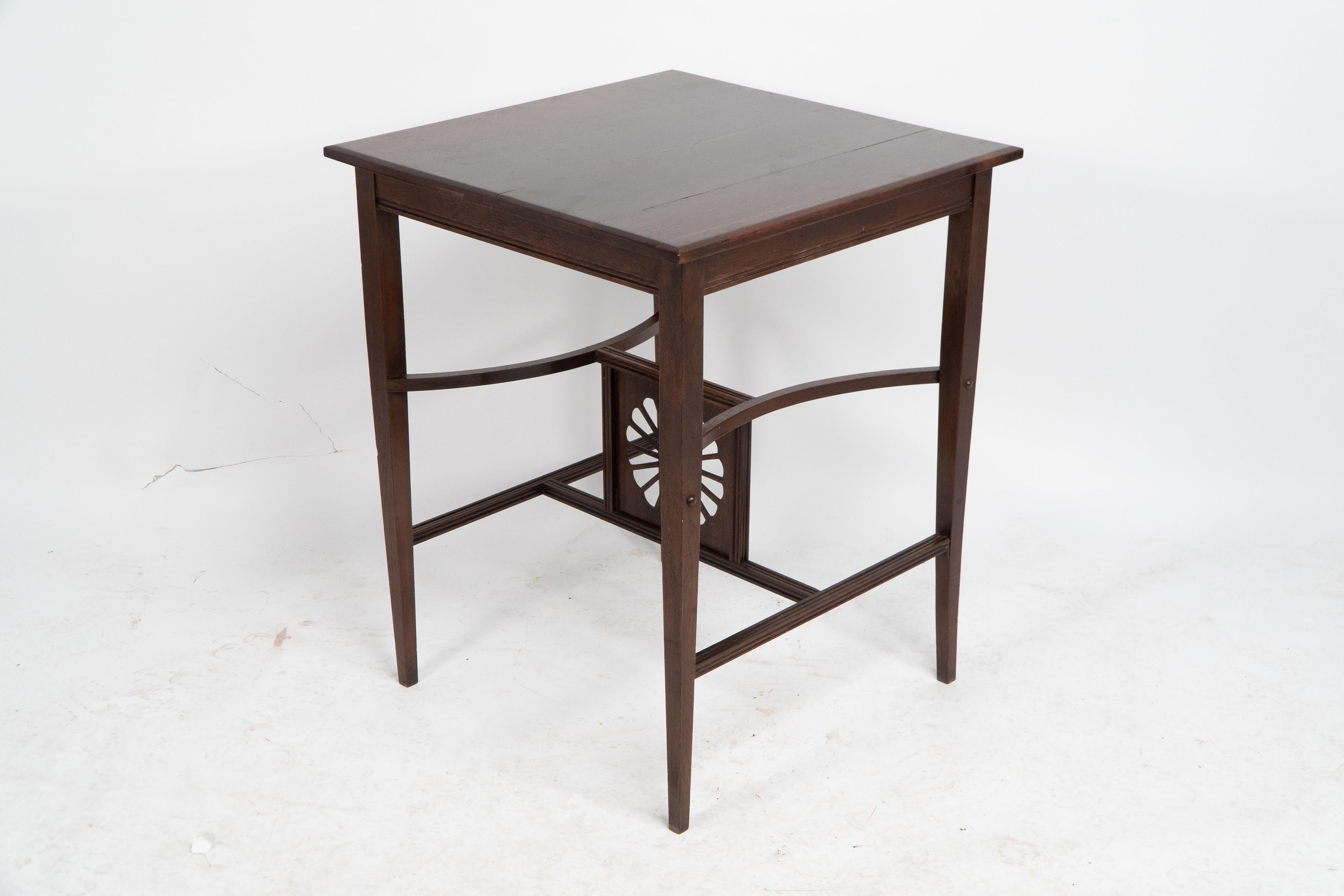 Late 19th Century Aesthetic Movement side table with sunflower & curved & straight side stretchers For Sale