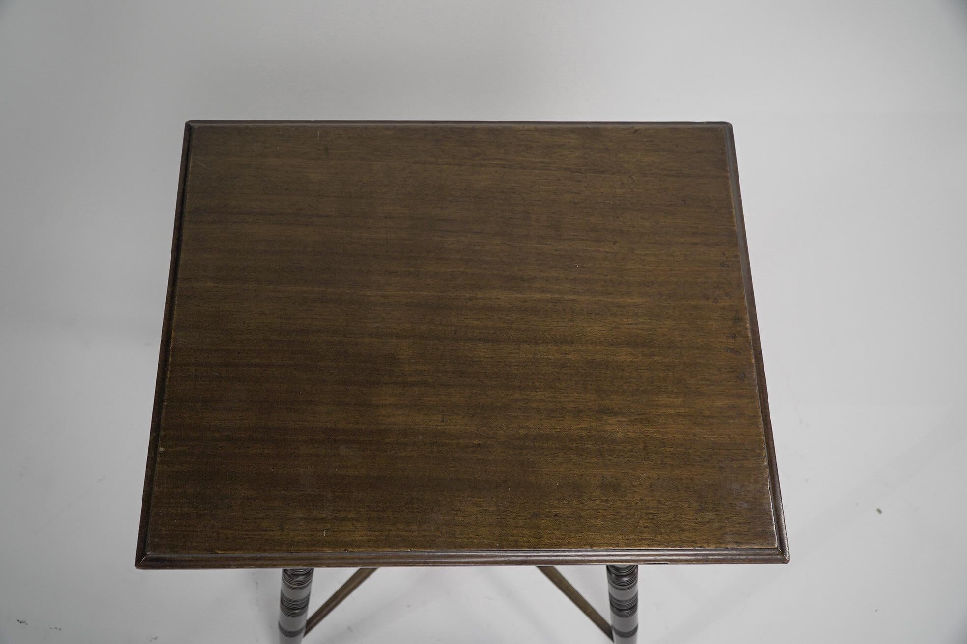 An Aesthetic Movement side table with scroll supports stood on ring turned legs In Good Condition For Sale In London, GB