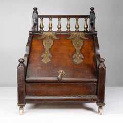 An Aesthetic Movement walnut coal box