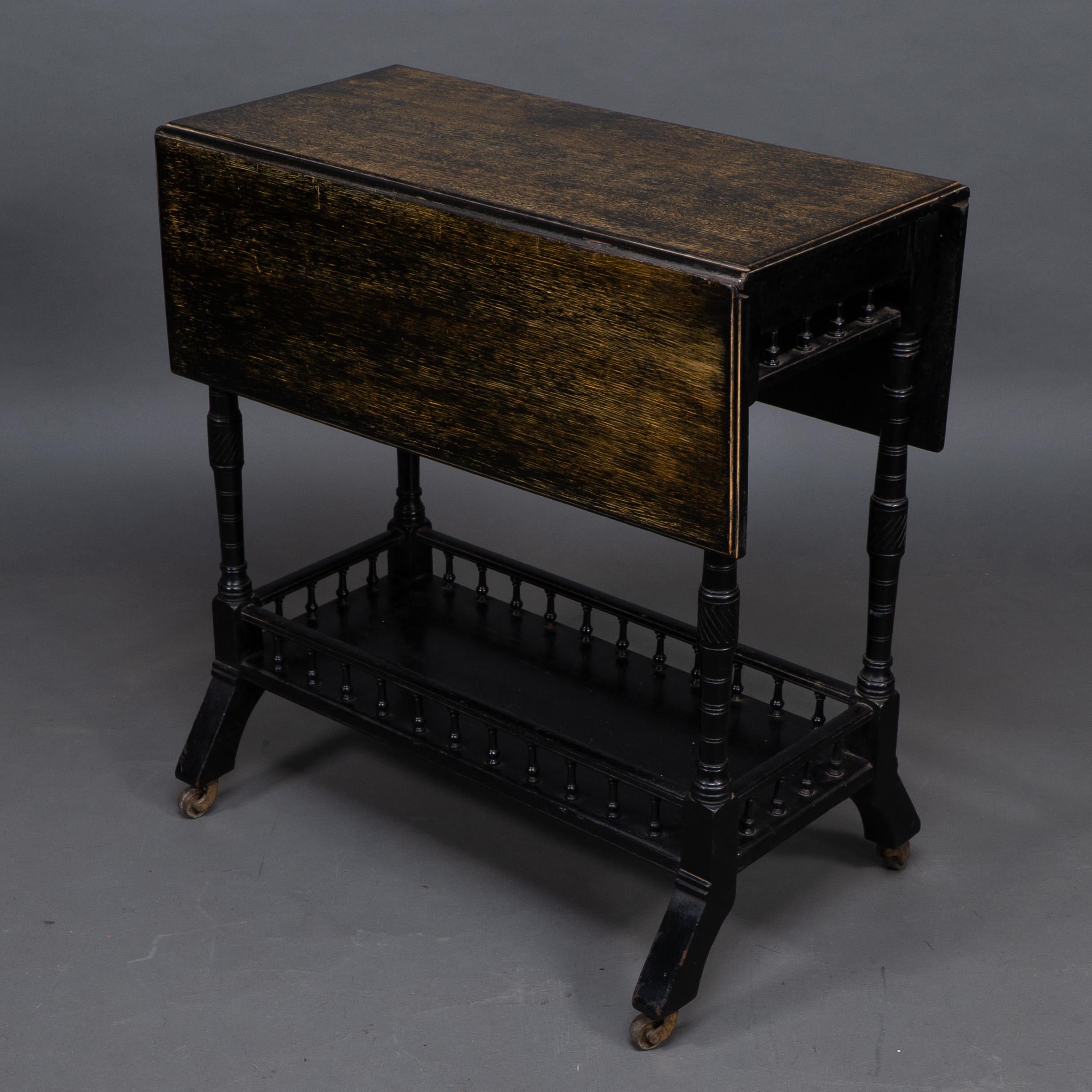 Late 19th Century An Aesthetic Movement walnut drop leaf side table on four turned & incised legs For Sale