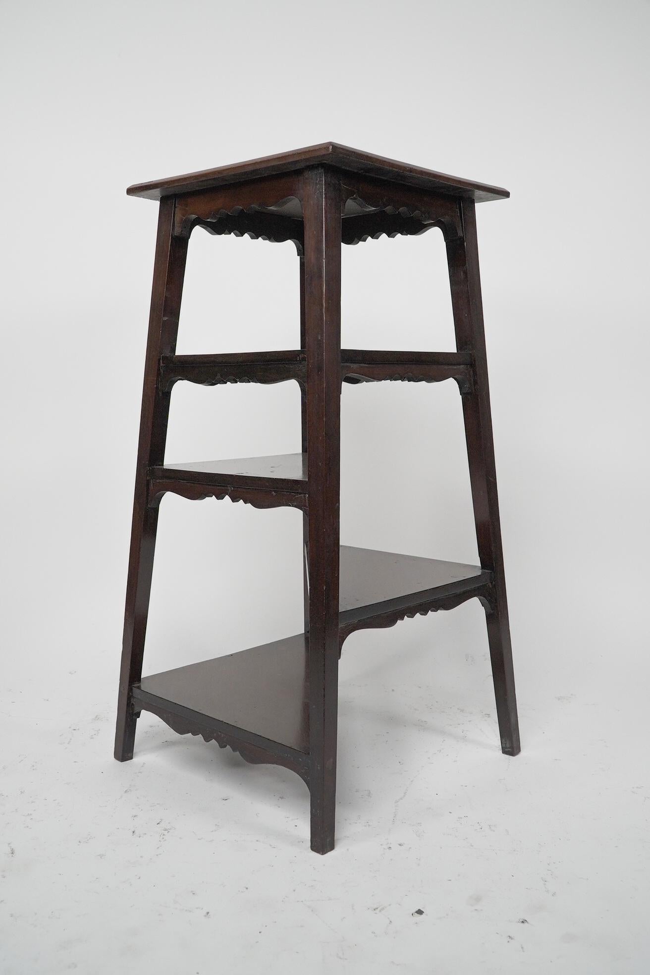 English Aesthetic Movement Walnut side table wot-not-stand with half triangle shelves. For Sale