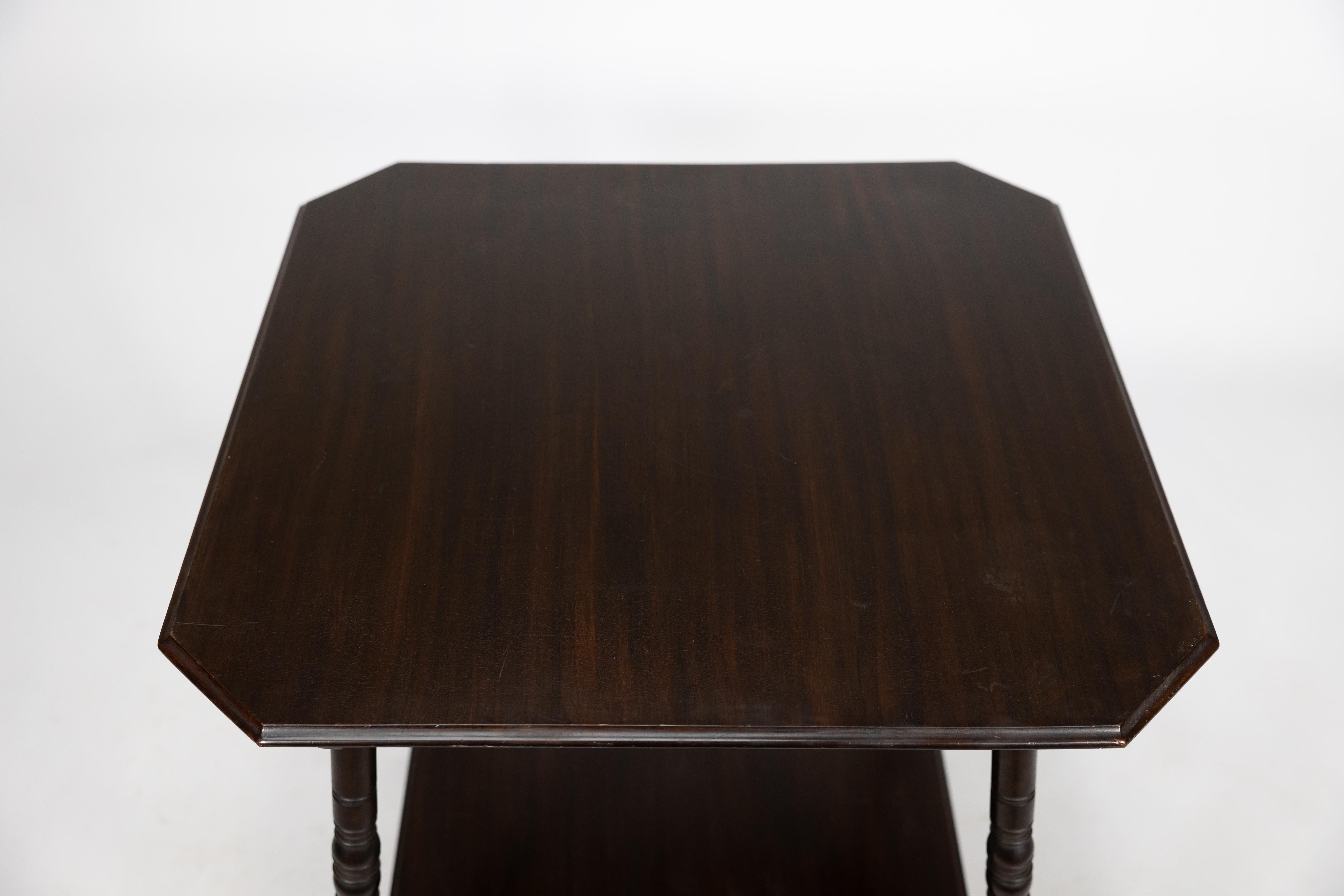 An Aesthetic Movement walnut two-tier side table with canted corners For Sale 11