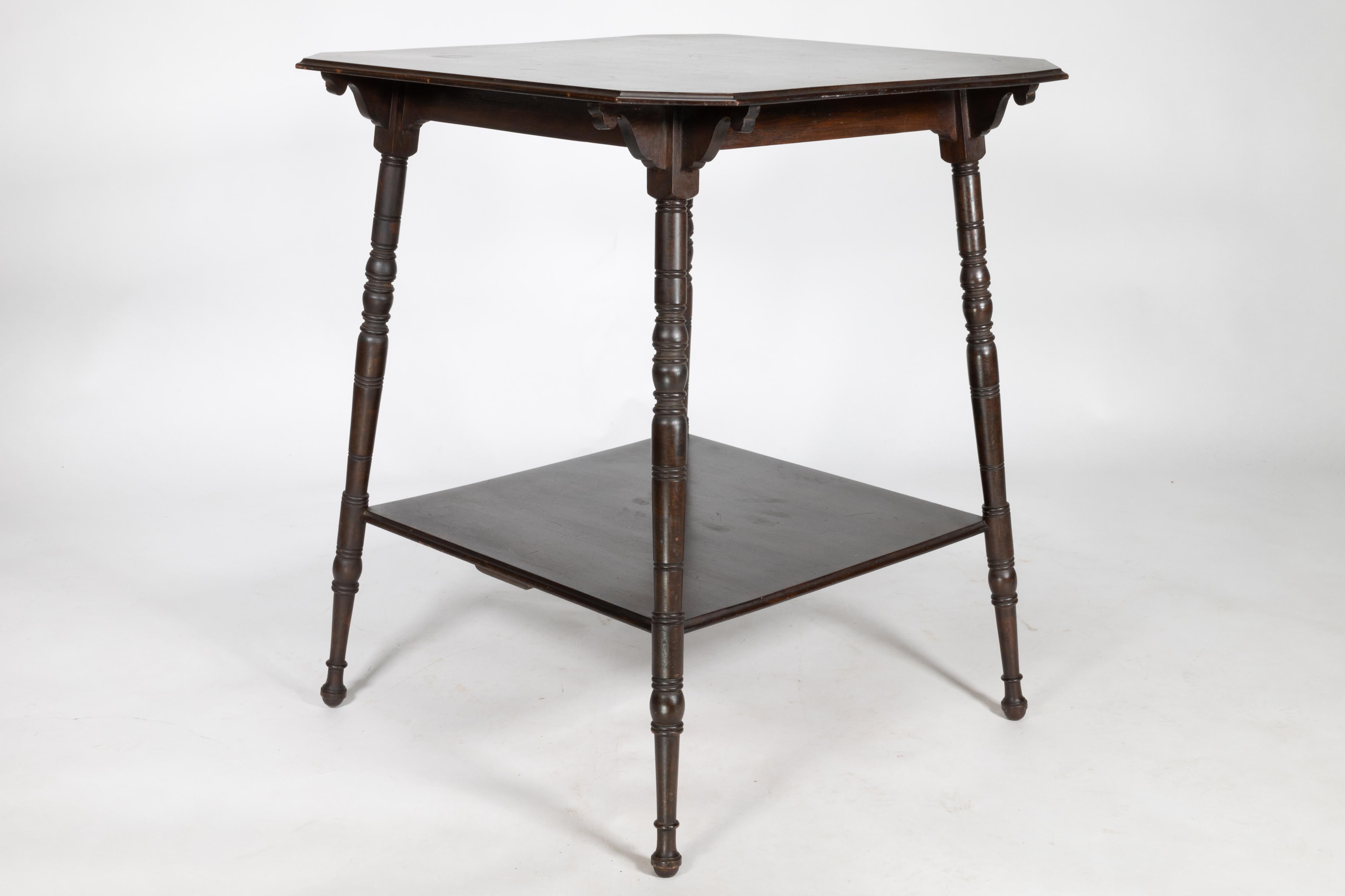An Aesthetic Movement walnut two-tier side table with canted corners In Good Condition For Sale In London, GB