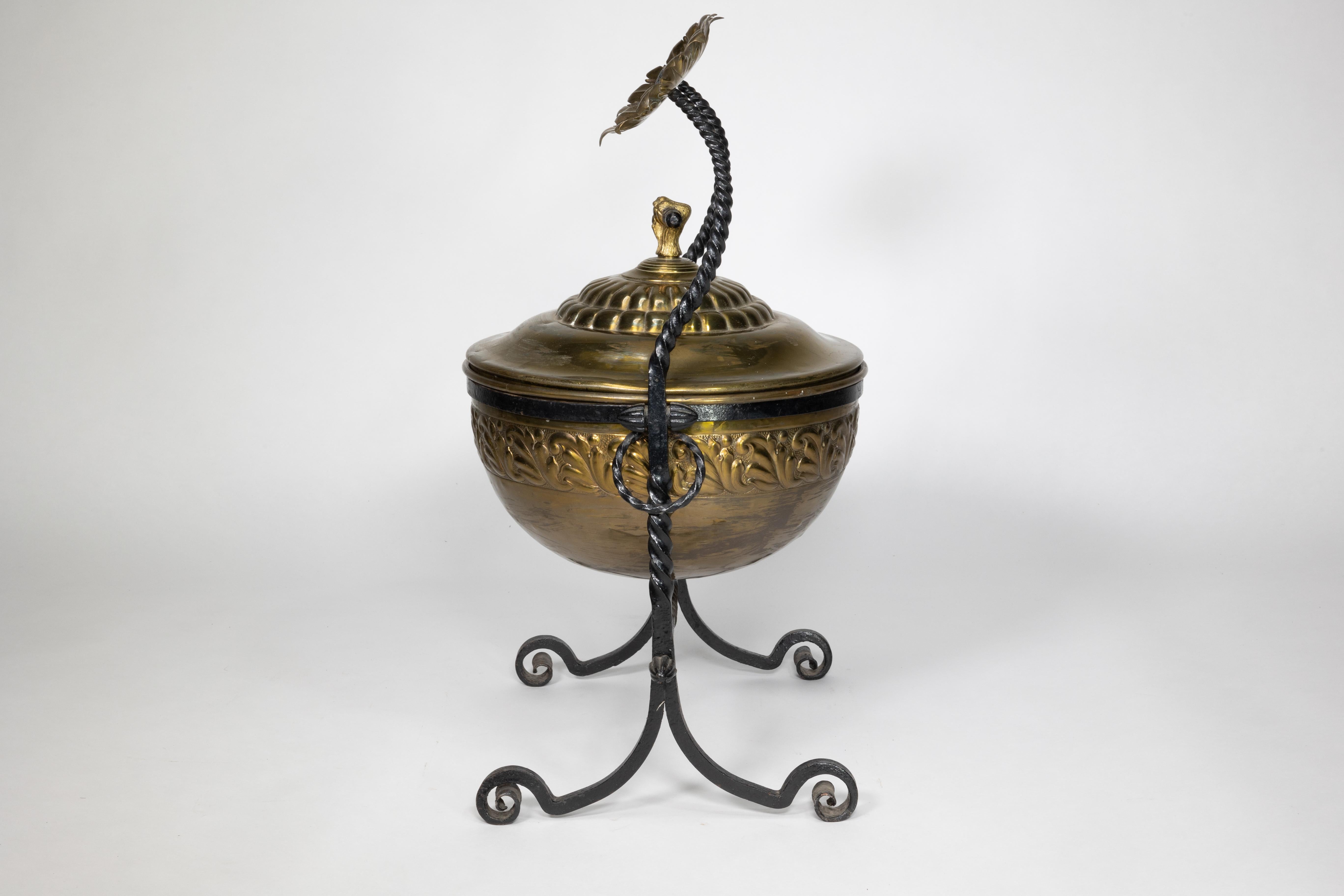 Late 19th Century An Aesthetic Movement wrought iron and copper fire bucket with sunflower finials For Sale