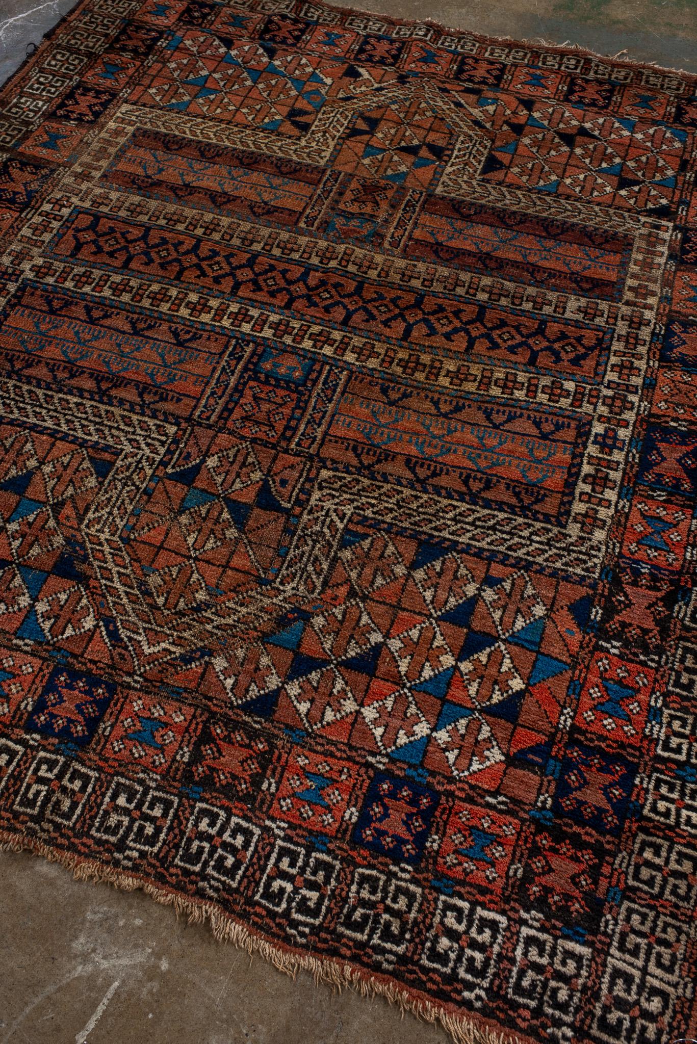 An Afghan Rug circa 1930. Hand Knotted and made of 100% wool yarn.