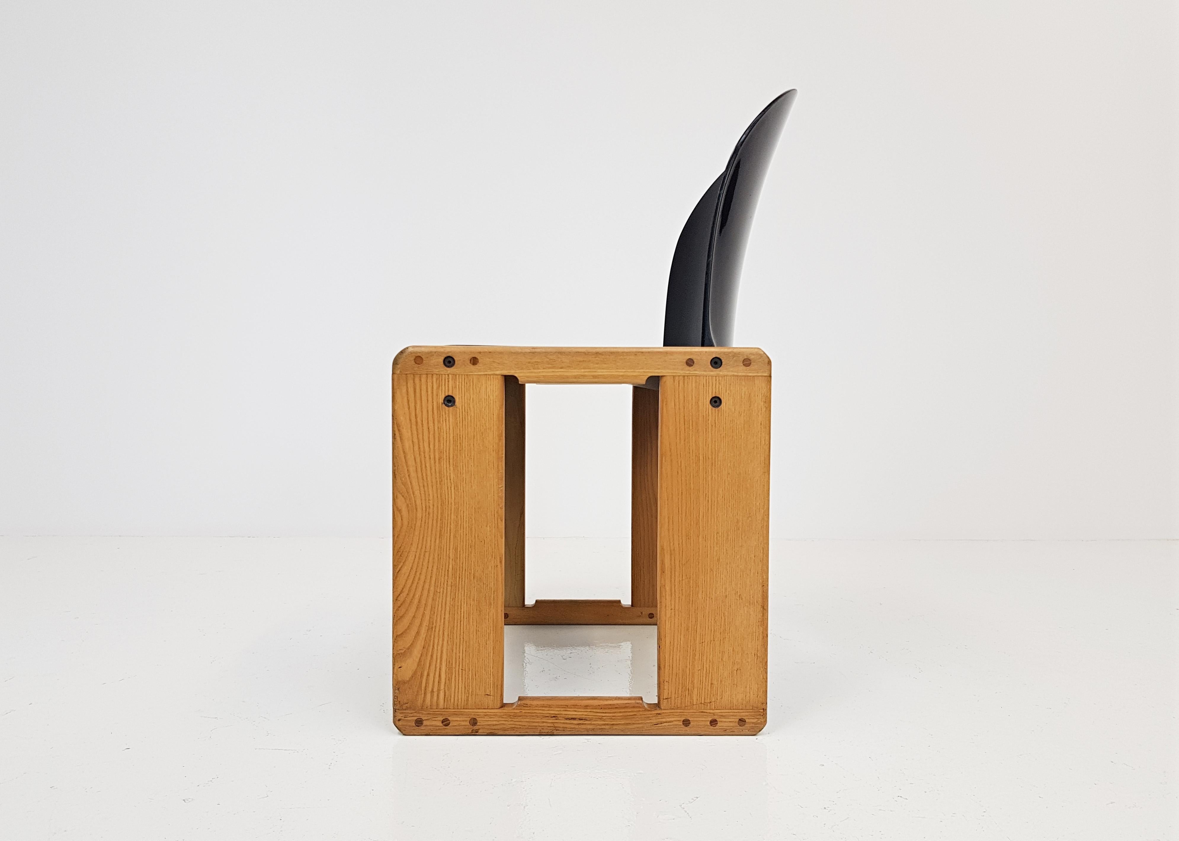 An Afra and Tobia Scarpa Dialogo chair for B&B Italia, 1970s.

The pieces feature an oak angular frame with a black fibreglass seat and back. The chairs are embossed with the B&B Italia makers mark.

Afra and Tobia Scarpa were award-winning