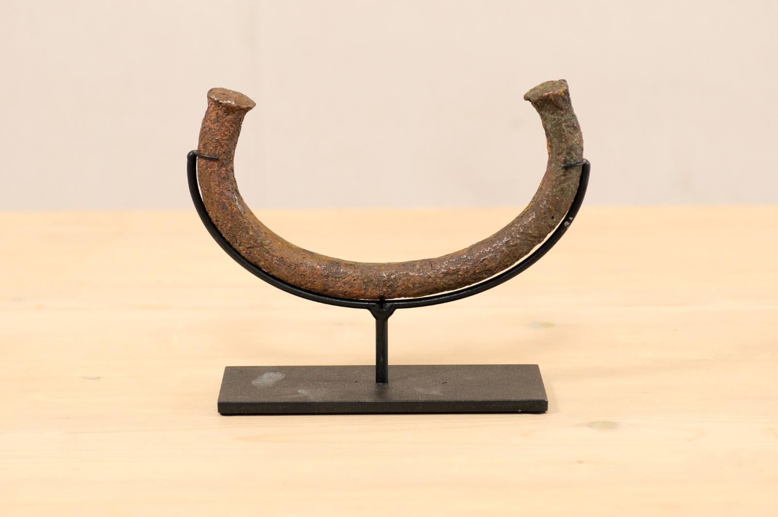 An African Manilla Trade Currency on Custom Iron Stand 2