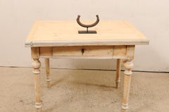 An African Manilla Trade Currency on Custom Iron Stand