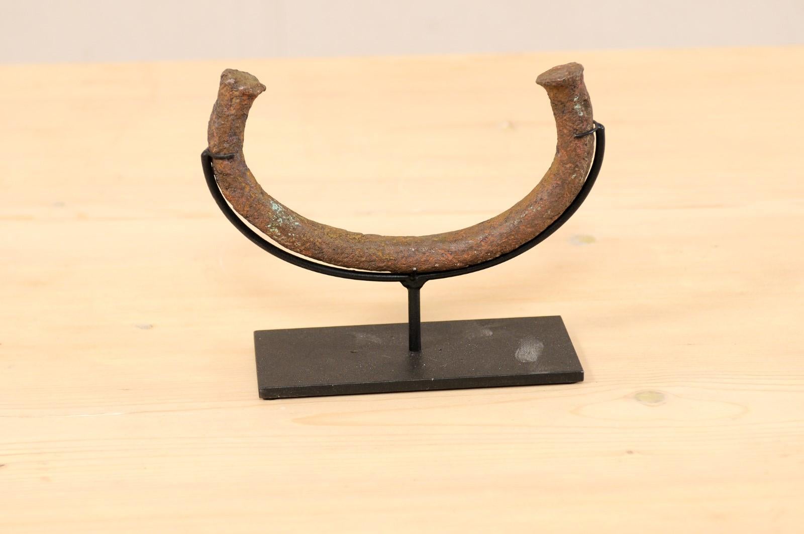 Tribal An African Manilla Trade Currency on Custom Iron Stand