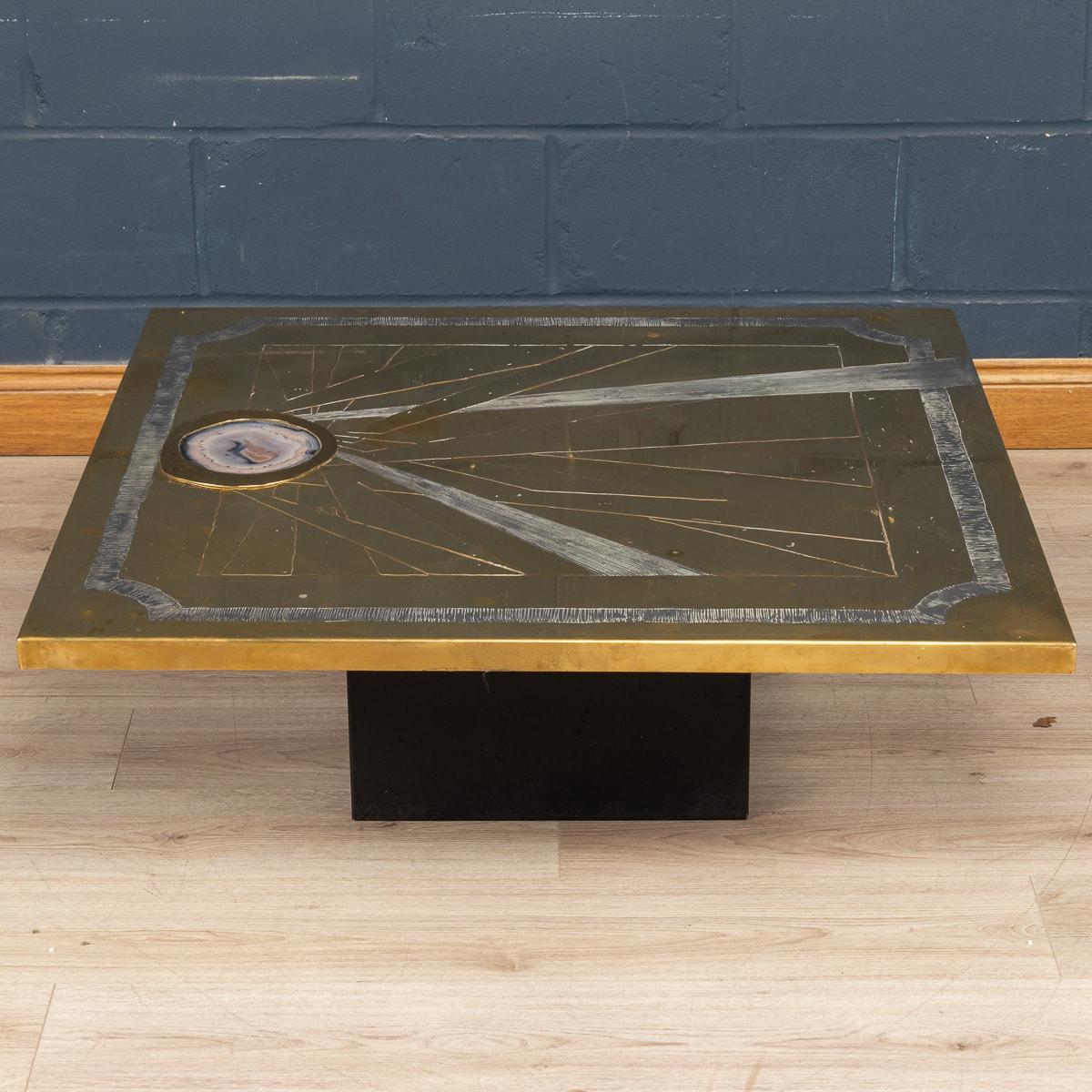 A rare and unusual coffee table by Willy Daro, made in Belgium in the 1970s. The coffee table embossed and acid etched on brass with an agate inset and abstract motifs. Signed 