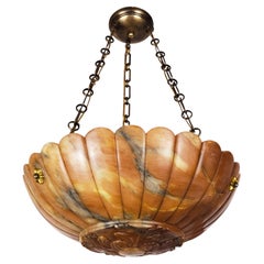 An Alabaster Pendant with Scalloped Edge