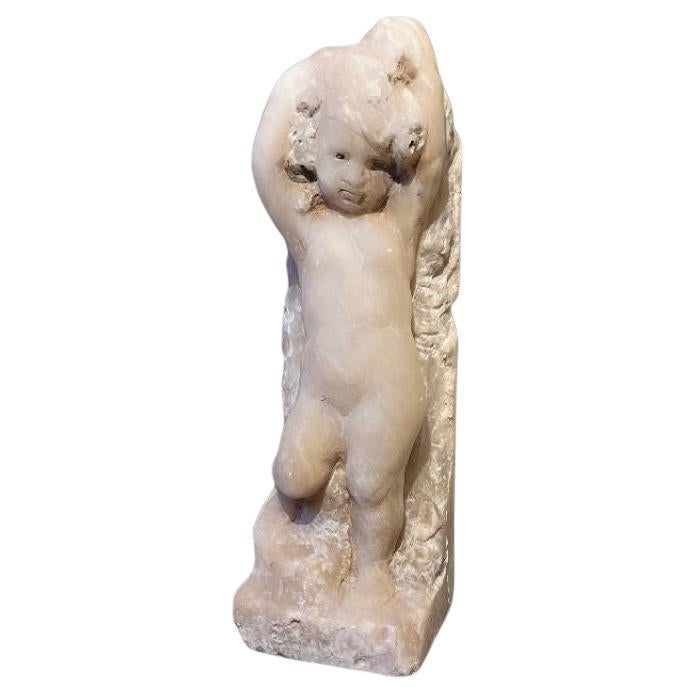An alabaster relief memorial figure
