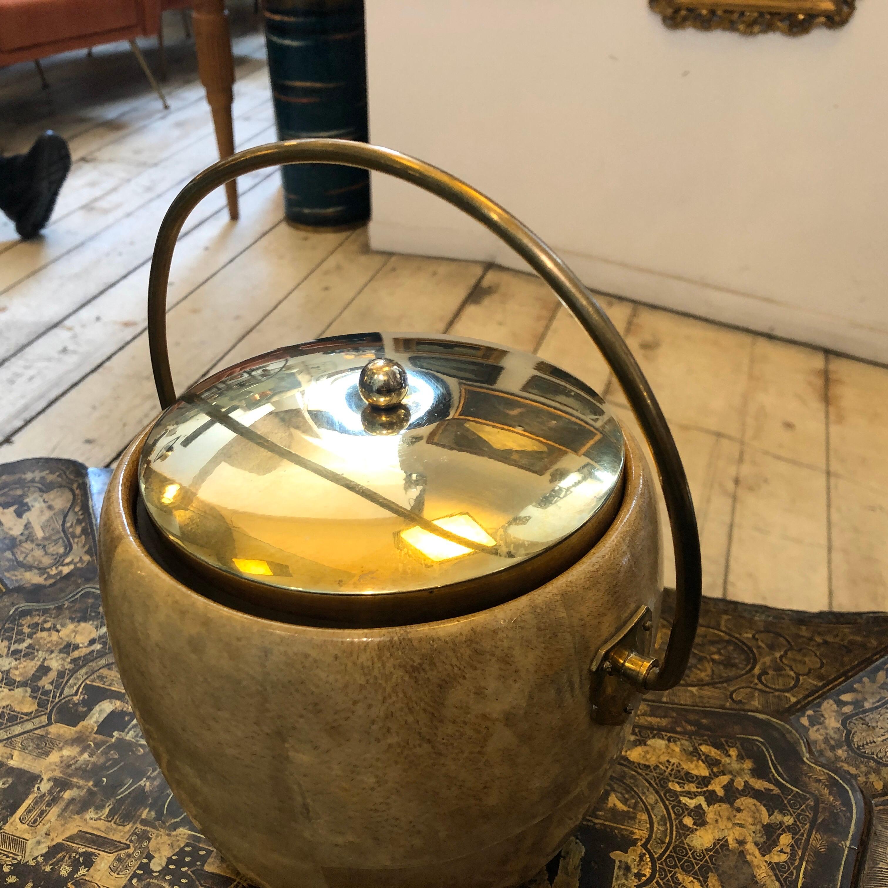An ice bucket made in Italy in the 1960s by Macabo and designed by Aldo Tura, good conditions overall, brass in original patina.
