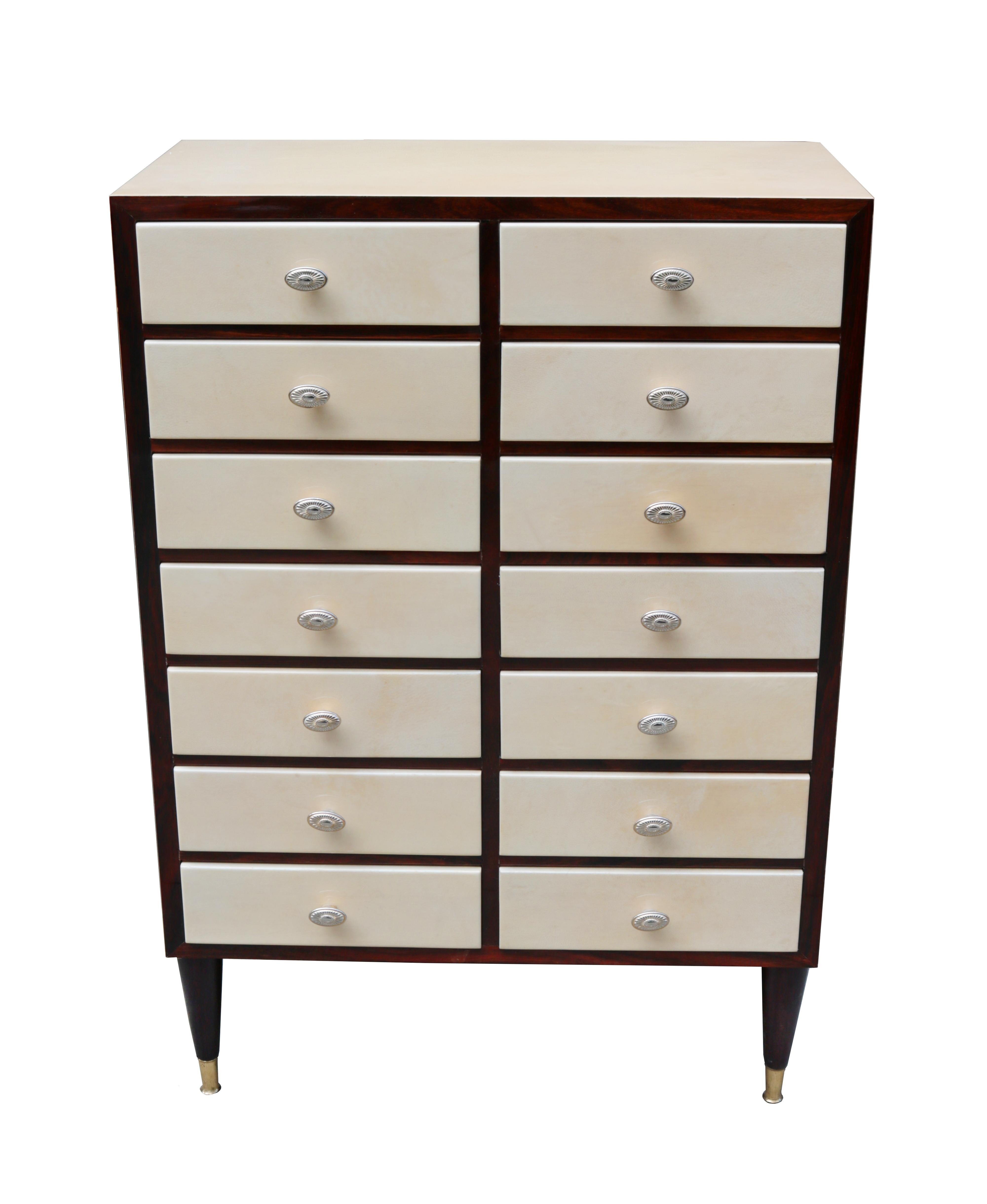 An Aldo Tura modernist small chest. Parchment with wood accents and legs, patinated brass sabots and pulls.
              