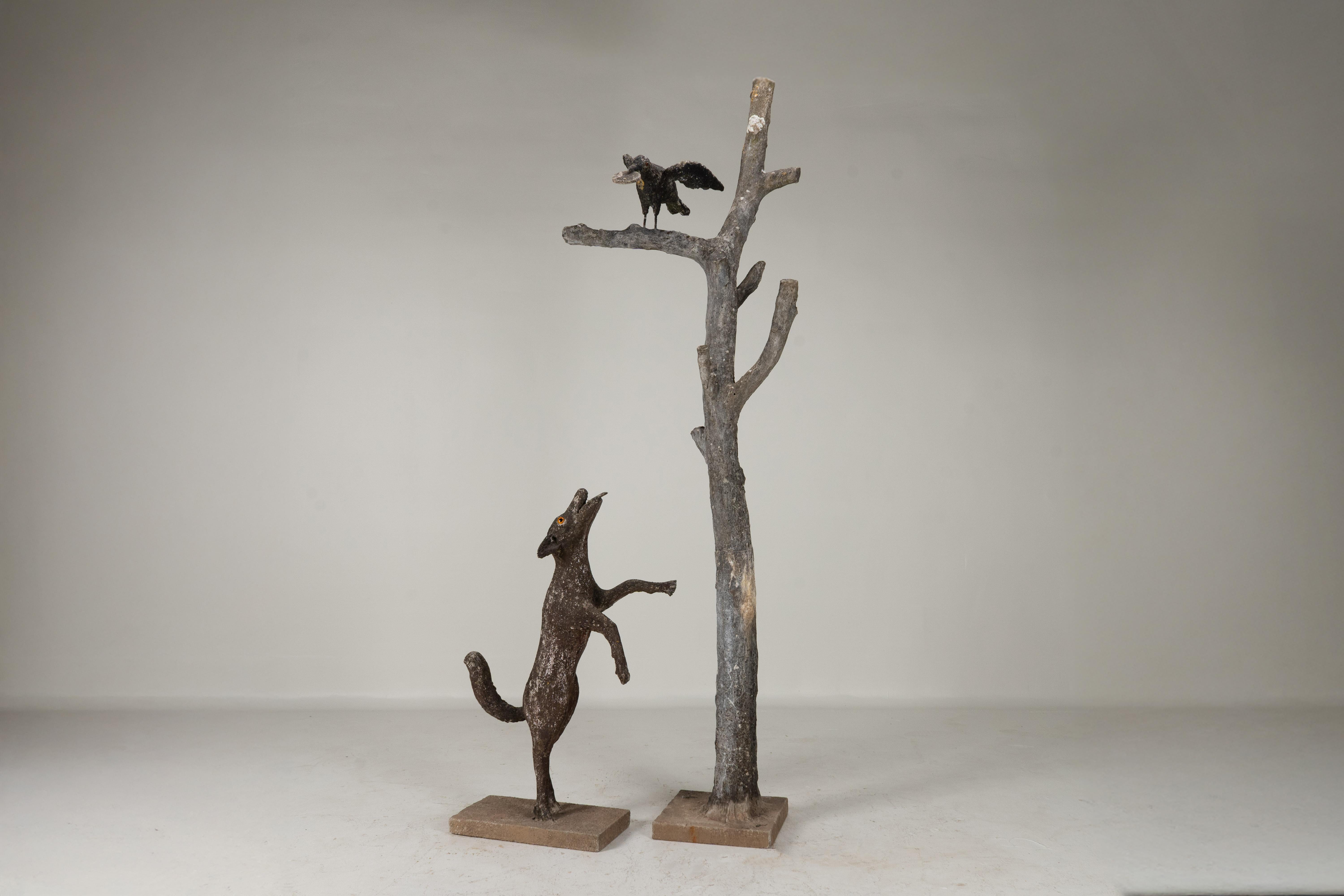 A faux bois sculpture after the allegorical poem by Jean De La Fontaine. Faux bois were at the height of its popularity during the Art Nouveau era in France around the turn of the century. Faux bois is the product of iron rods and mesh combined with