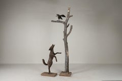 An Allegorical Sculpture of a Dog and A Crow on a Tree