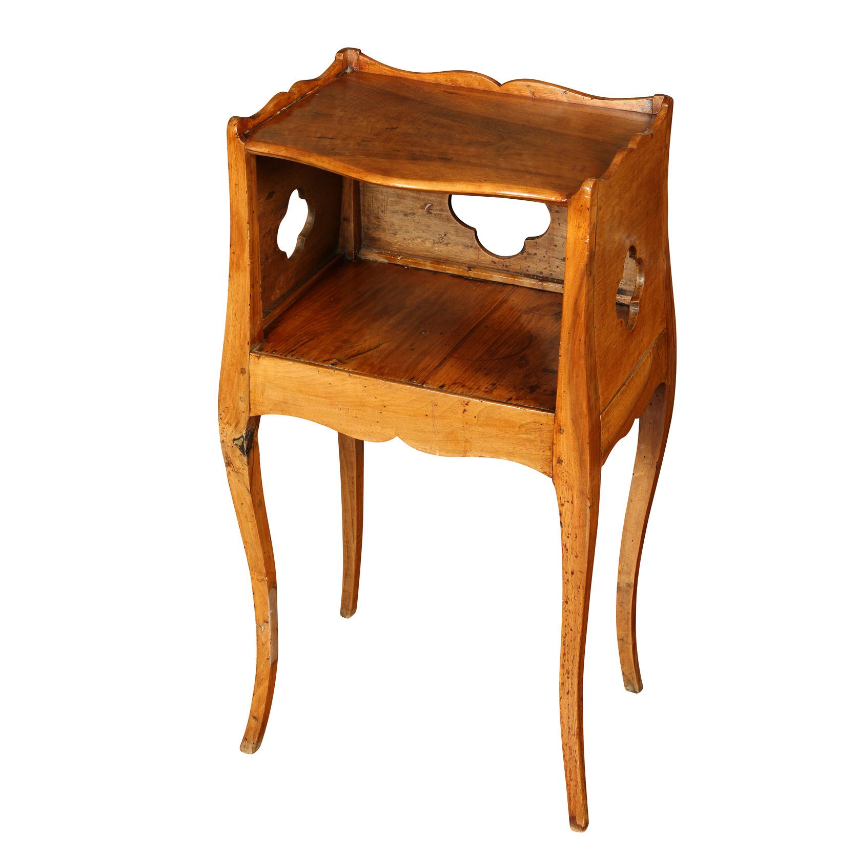 An almost pair of French fruitwood antique nightstands with an open cubby and cabriole legs, one slightly larger with quatrefoil cutouts on three sides.