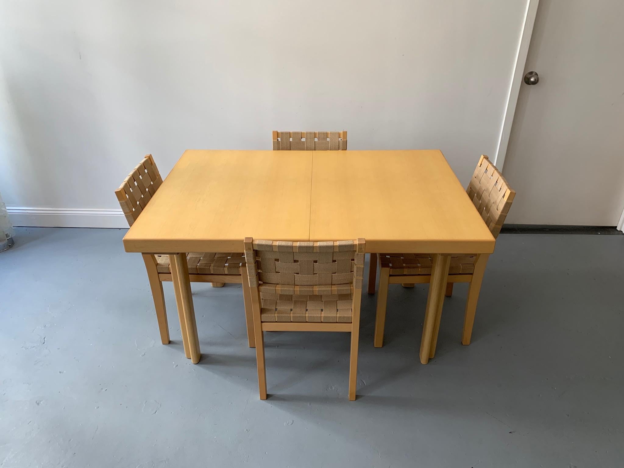 Alvar Aalto originally designed this table in 1954. The table is made of ash and Nordic birch. The table has two leaves that are stored inside the table and allow the table to expand from 51.25” to 91.5”. The table has it’s original finish and is in