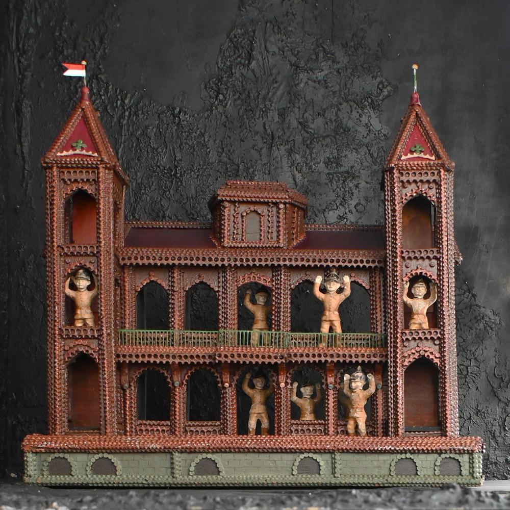 An amazing Early 20th century European Tramp art castle model 
Quite simply this is one of the most unusual pieces of sculpture tramp art that we have uncovered in a long time, built using a technique called chip or notch carving on pine sectioned