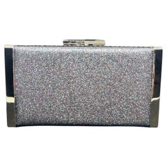 An amazing Jimmy Choo Silver Fine Glitter Fabric and Metal Clutch Bag