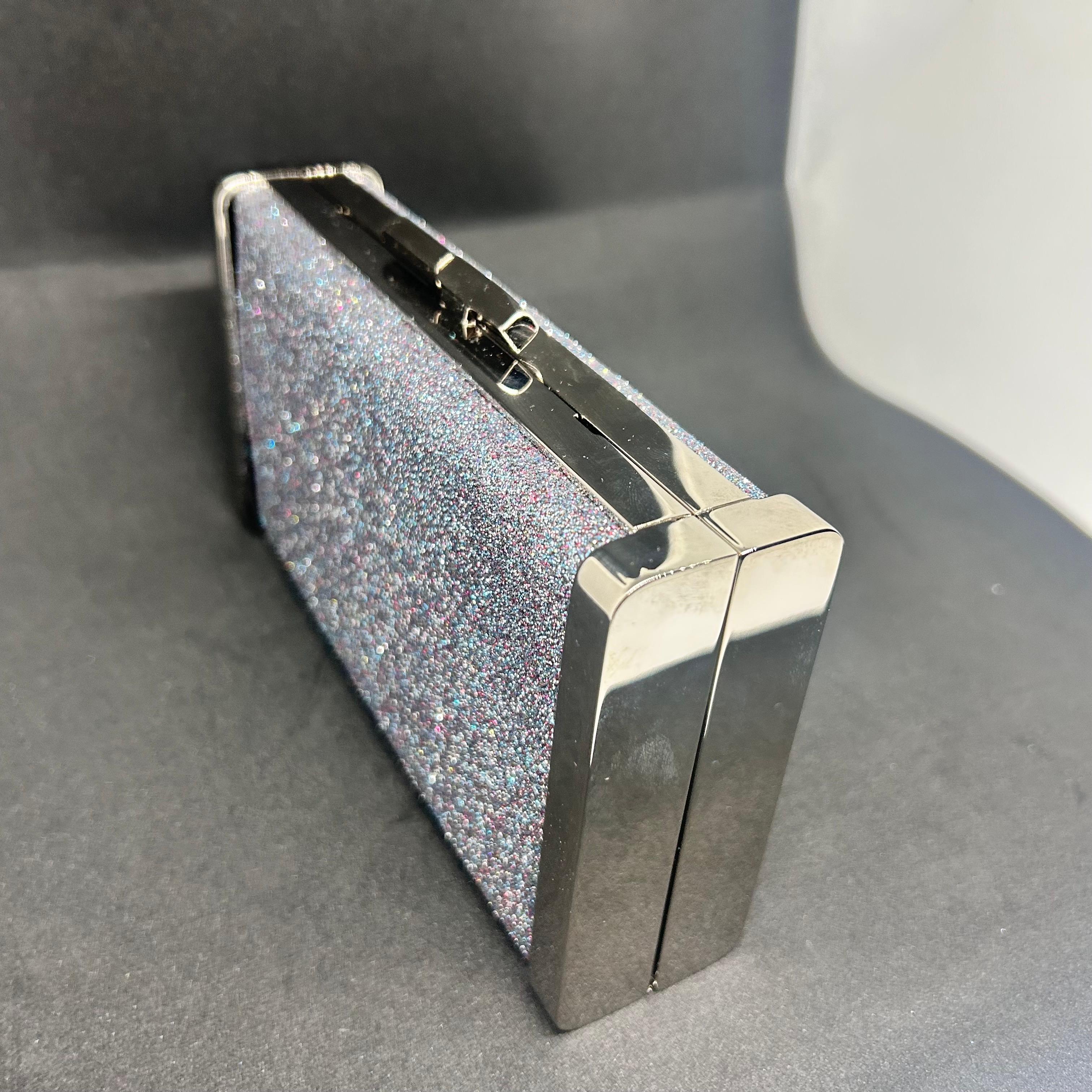 An amazing Jimmy Choo Silver Fine Glitter Fabric and Metal Clutch Bag In Excellent Condition For Sale In Aci Castello, IT