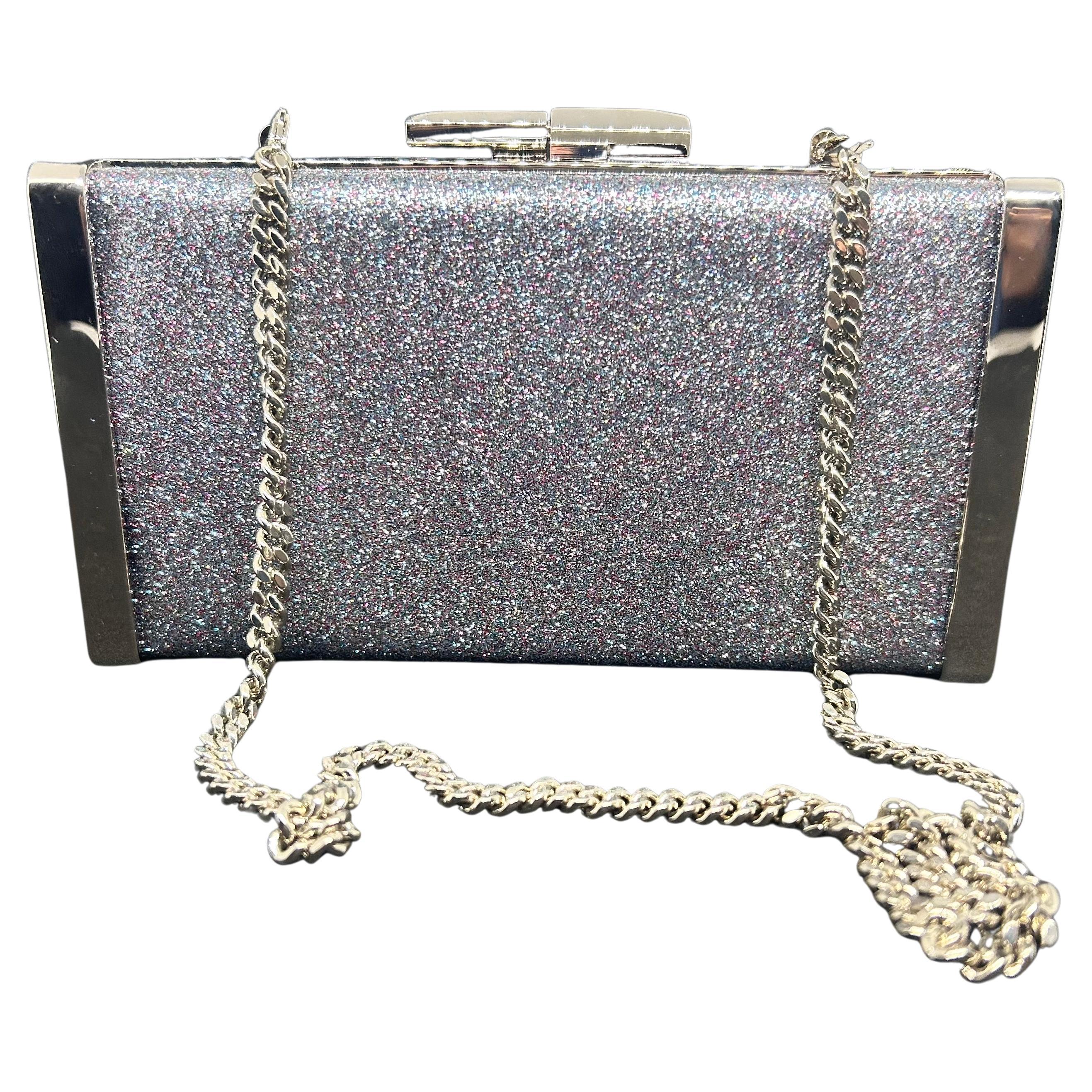 An amazing Jimmy Choo Silver Fine Glitter Fabric and Metal Clutch Bag For Sale